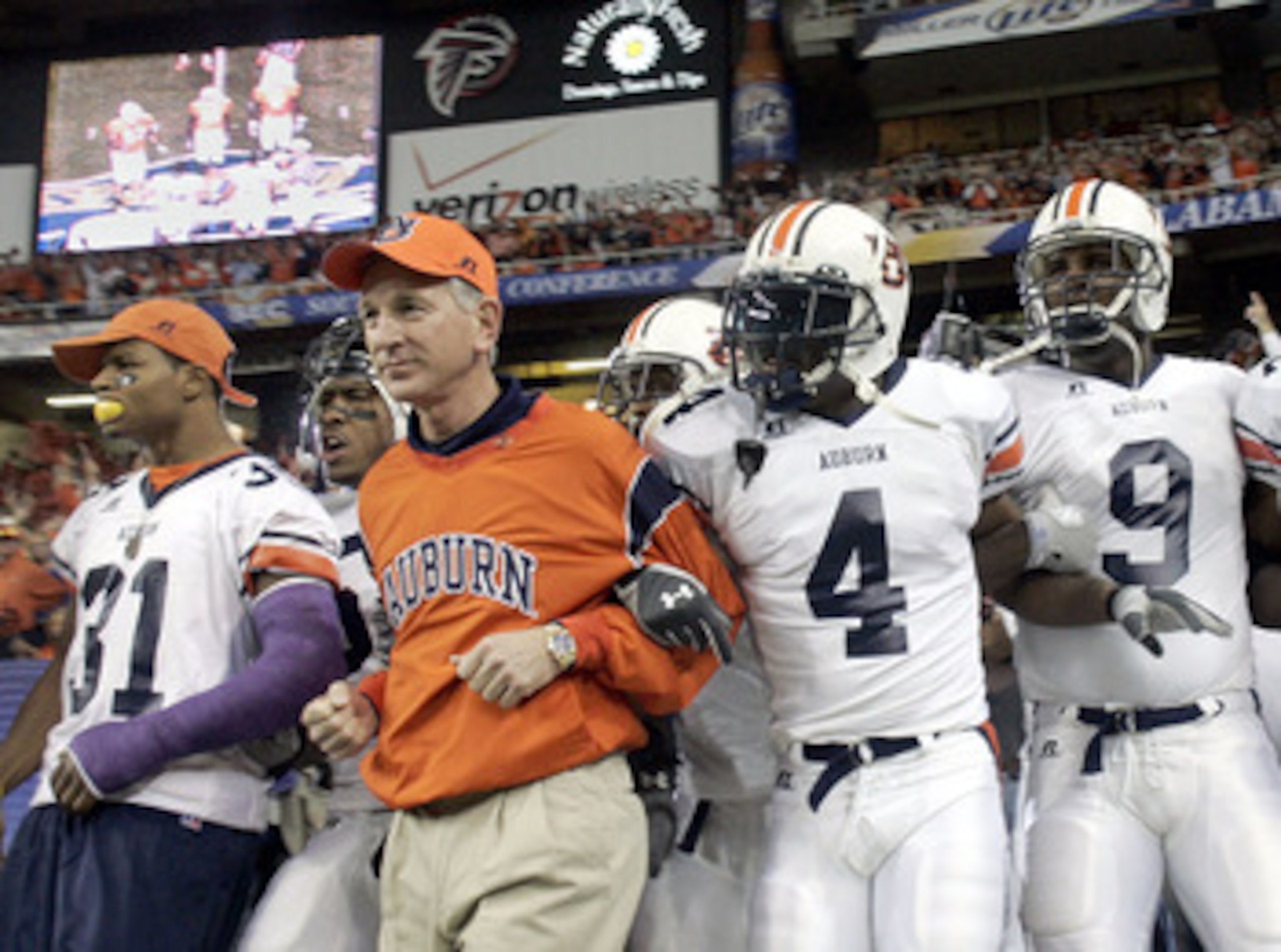 ATLANTA - DECEMBER 4: Head coach Tommy Tuberville of the Auburn Tigers leads his team onto the field against the Tennessee Volunteers in the 2004 SEC Championship Game at the Georgia Dome on December 4, 2004 in Atlanta, Georgia. (Photo by Grant Halverson ATLANTA - DECEMBER 4: Head coach Tommy Tuberville of the Auburn Tigers leads his team onto the field against the Tennessee Volunteers in the 2004 SEC Championship Game at the Georgia Dome on December 4, 2004 in Atlanta, Georgia. (Photo by Grant Halverson