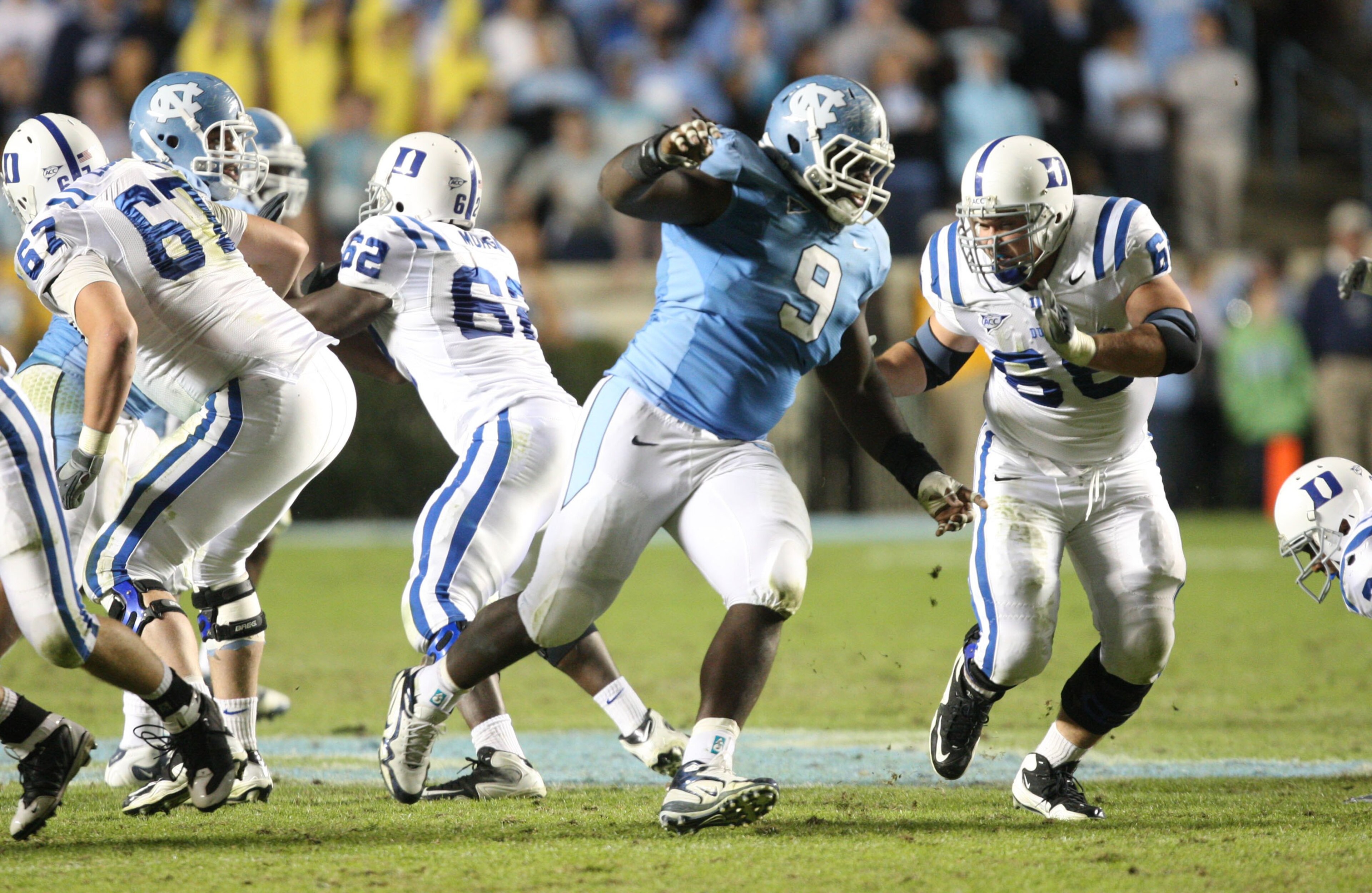 CHAPEL HILL, NC - NOVEMBER 7: Marvin Austin #9 of the North Carolina Tar Heels rushes against Brian Moore #68 of the Duke Blue Devils at Kenan Stadium on November 7, 2009 in Chapel Hill, North Carolina. (Photo by Streeter Lecka/Getty Images) CHAPEL HILL, NC - NOVEMBER 7: Marvin Austin #9 of the North Carolina Tar Heels rushes against Brian Moore #68 of the Duke Blue Devils at Kenan Stadium on November 7, 2009 in Chapel Hill, North Carolina. (Photo by Streeter Lecka/Getty Images)