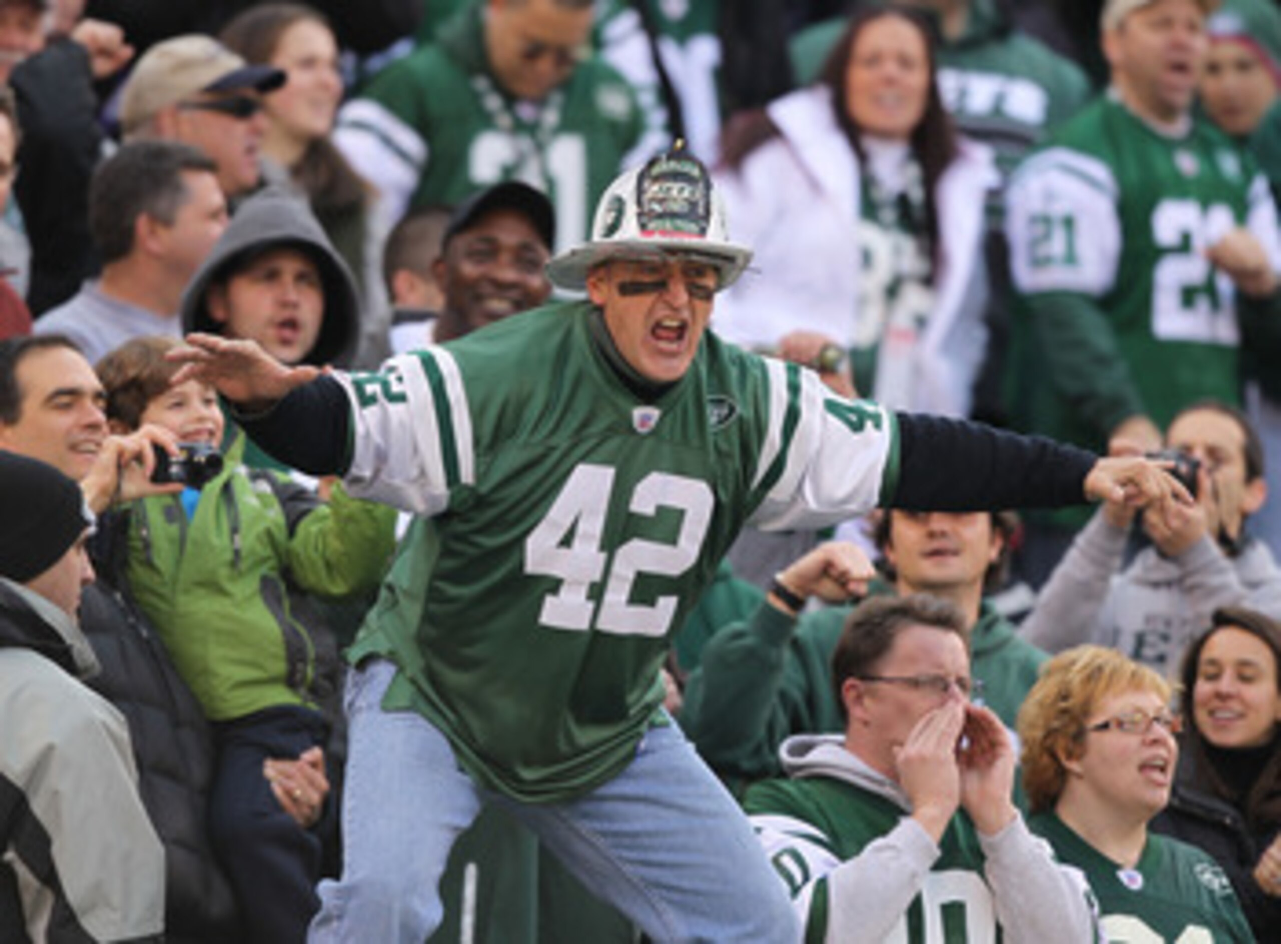 EAST RUTHERFORD, NJ - NOVEMBER 21:  Ed Anzalone, alias Fireman Eddie,  super fan of the New York Jets leads a cheer against the Houston Texans during their  game on November21, 2010 at the New Meadowlands Stadium  in East Rutherford, New Jersey.  (Photo b