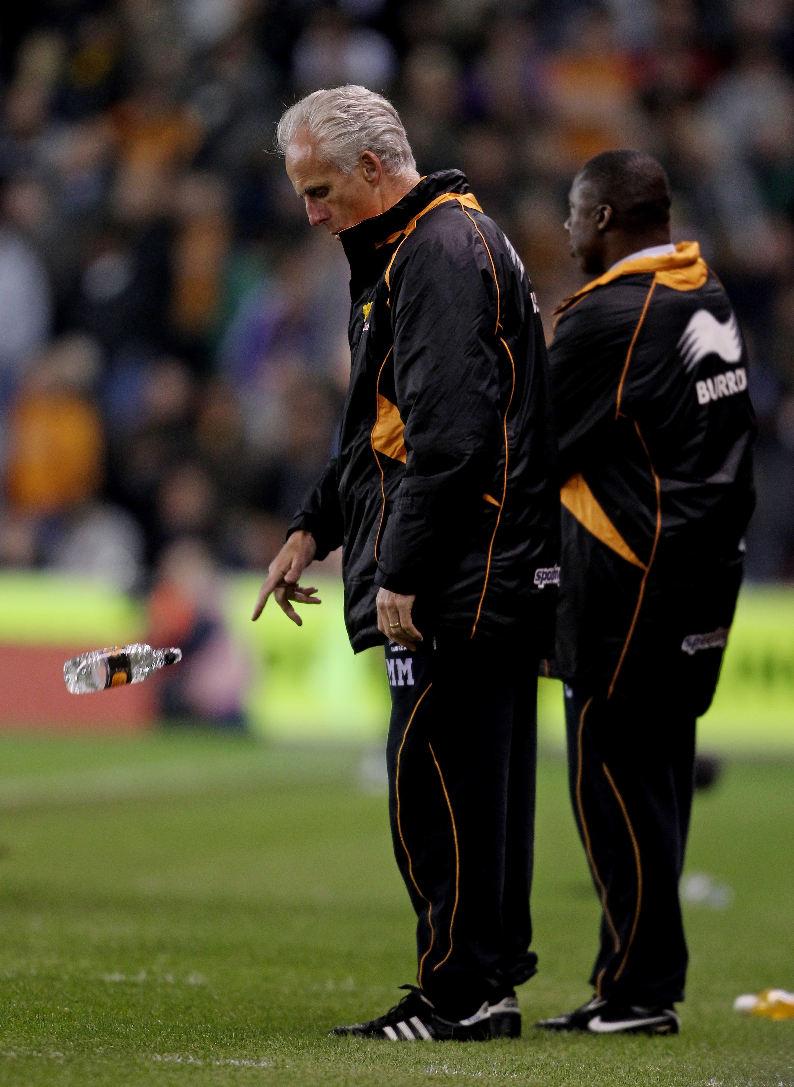 STOKE ON TRENT, ENGLAND - APRIL 26:  Wolves manager Mick McCarthy throws a water bottle during the Barclays Premier League match between Stoke City and Wolverhampton Wanderers at Britannia Stadium on April 26, 2011 in Stoke on Trent, England.  (Photo by S