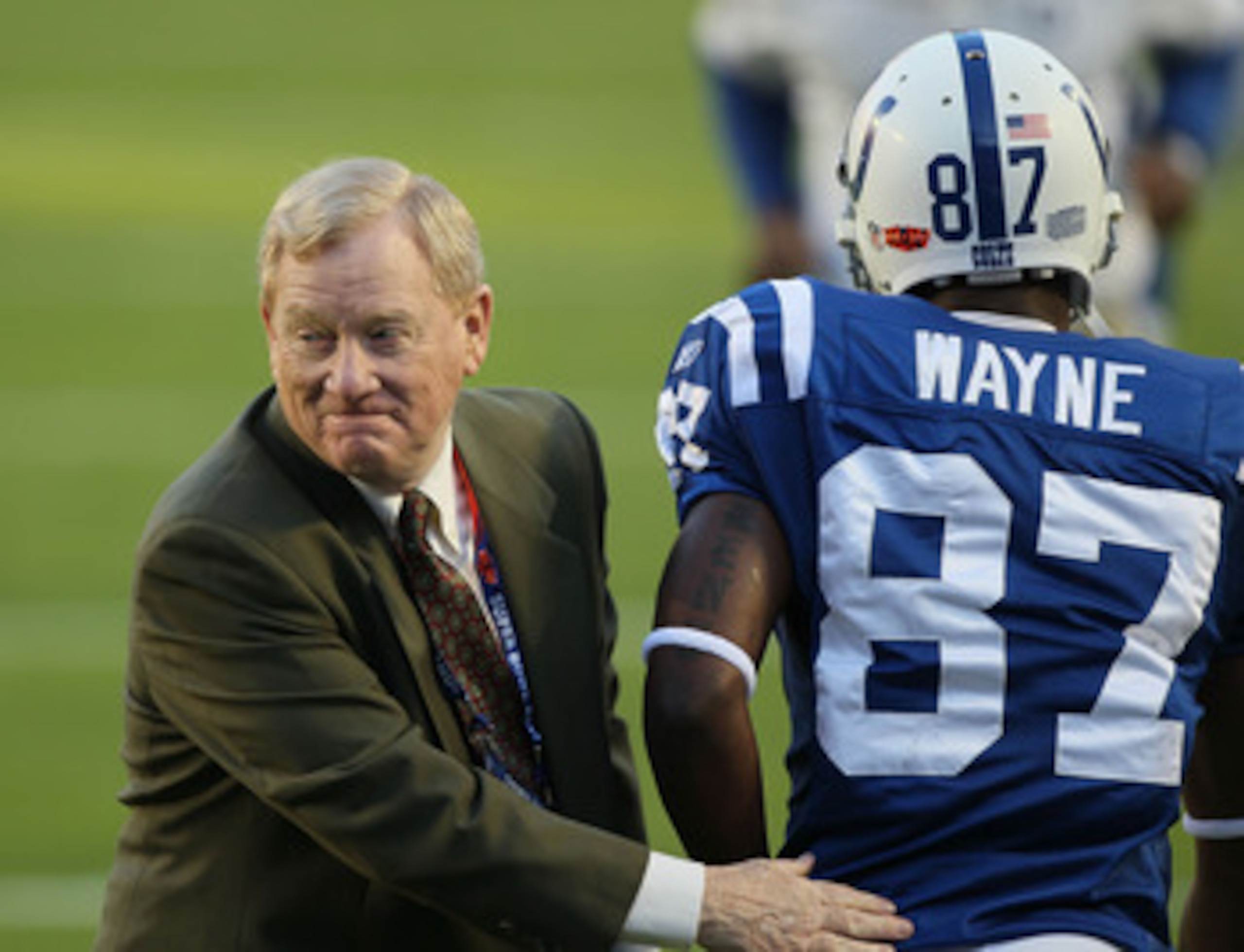 MIAMI GARDENS, FL - FEBRUARY 07: President of the Indianapolis Colts Bill Polian greets wide receiver Reggie Wayne #87 of the Indianapolis Colts on the field prior to Super Bowl XLIV against the New Orleans Saints on February 7, 2010 at Sun Life Stadium i