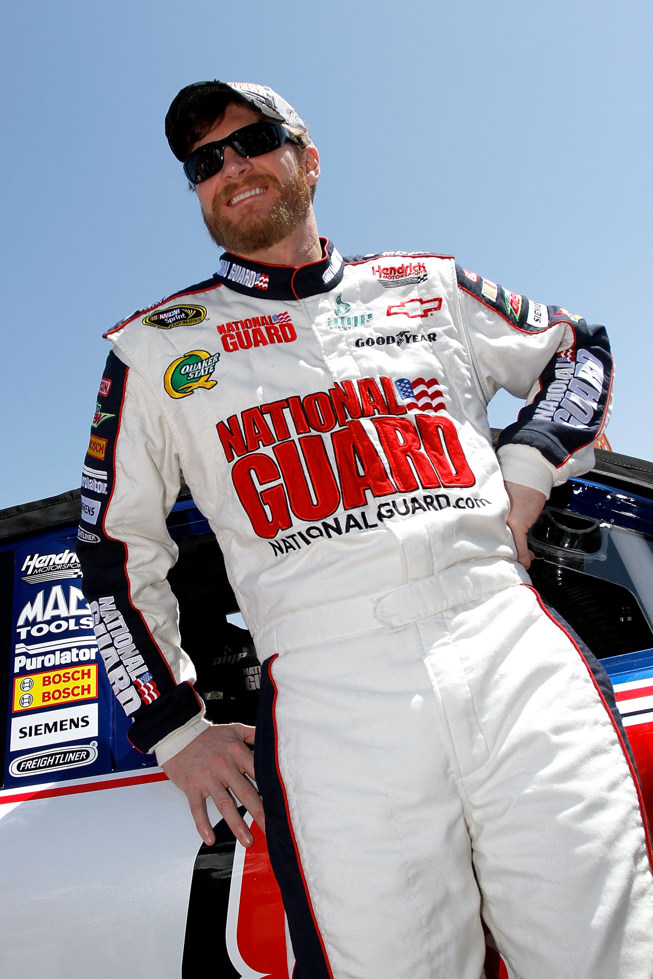 TALLADEGA, AL - APRIL 17:  Dale Earnhardt Jr., driver of the #88 National Guard/Amp Energy Chevrolet, stands on the grid prior to the start of the NASCAR Sprint Cup Series Aaron's 499 at Talladega Superspeedway on April 17, 2011 in Talladega, Alabama.  (P