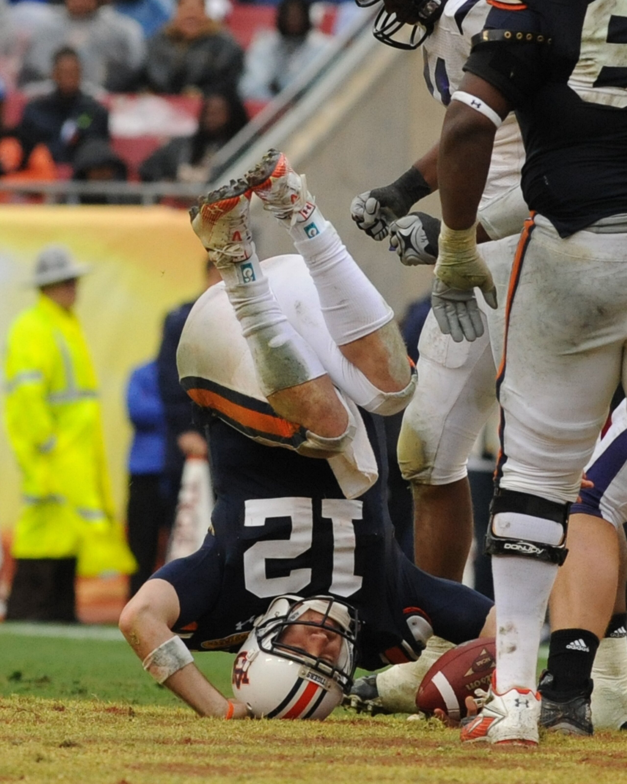 TAMPA, FL - JANUARY 1: Quarterback Chris Todd #12 of the Auburn Tigers tumbles for a sack against the Northwestern Wildcats in the Outback Bowl January 1, 2010 at Raymond James Stadium in Tampa, Florida.  (Photo by Al Messerschmidt/Getty Images)