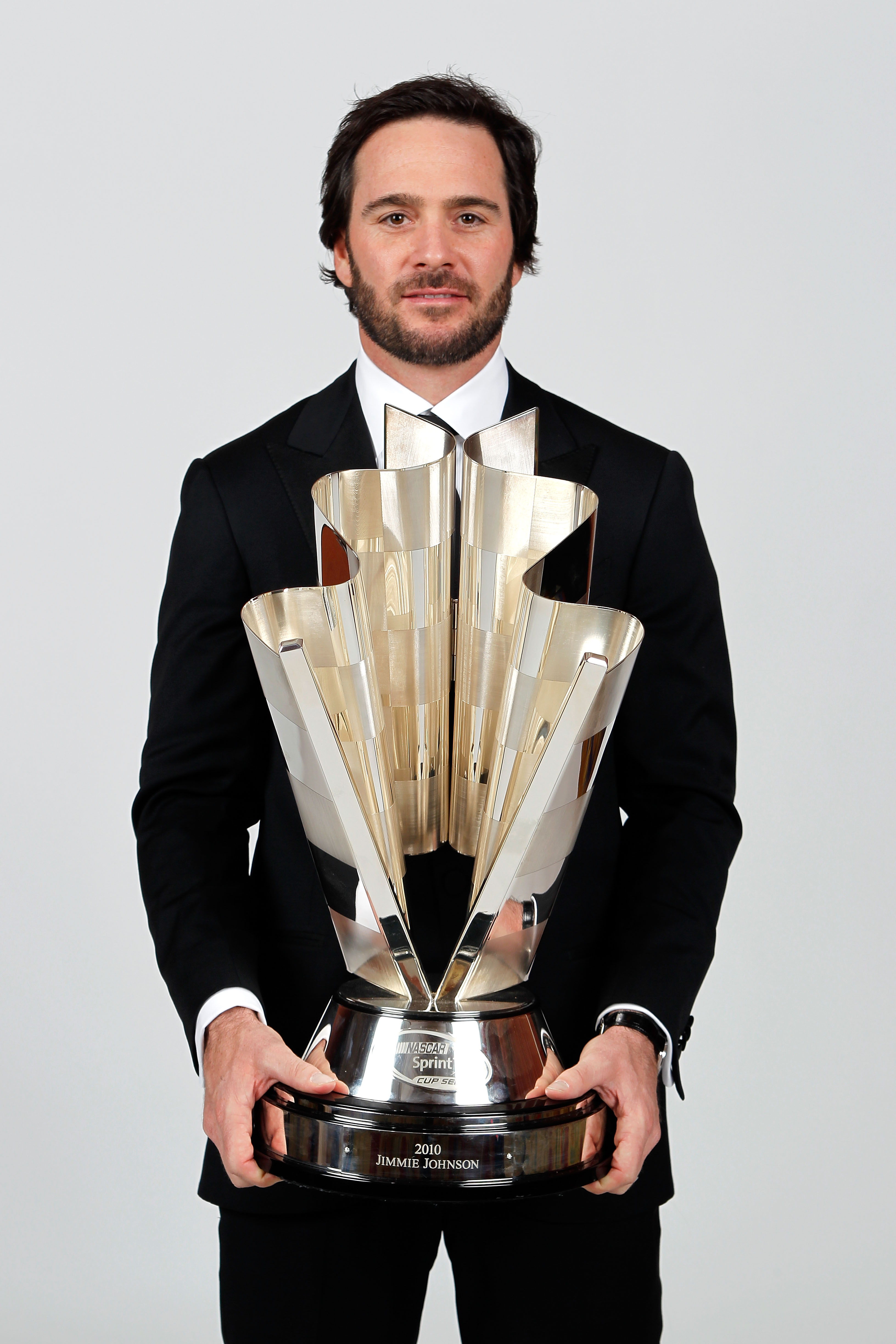 LAS VEGAS, NV - DECEMBER 03:  Five-time champion Jimmie Johnson poses with the Sprint Cup trophy during the NASCAR Sprint Cup Series awards banquet at the Wynn Las Vegas Hotel on December 3, 2010 in Las Vegas, Nevada.  (Photo by Todd Warshaw/Getty Images