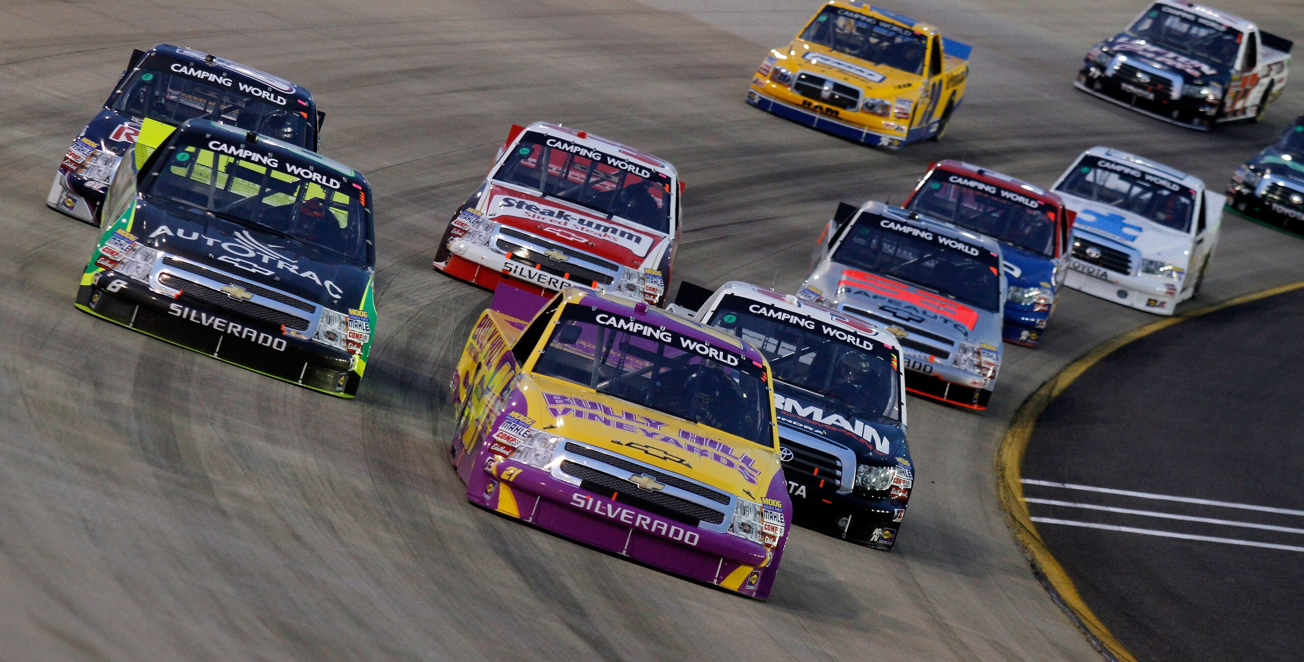 LEBANON, TN - APRIL 22: Elliott Sadler, driver of the #21 Bully Hill Vineyards Chevrolet, leads a pack of trucks during the NASCAR Camping World Truck Series Bully Hill Vineyards 200 at Nashville Superspeedway on April 22, 2011 in Lebanon, Tennessee.  (Ph