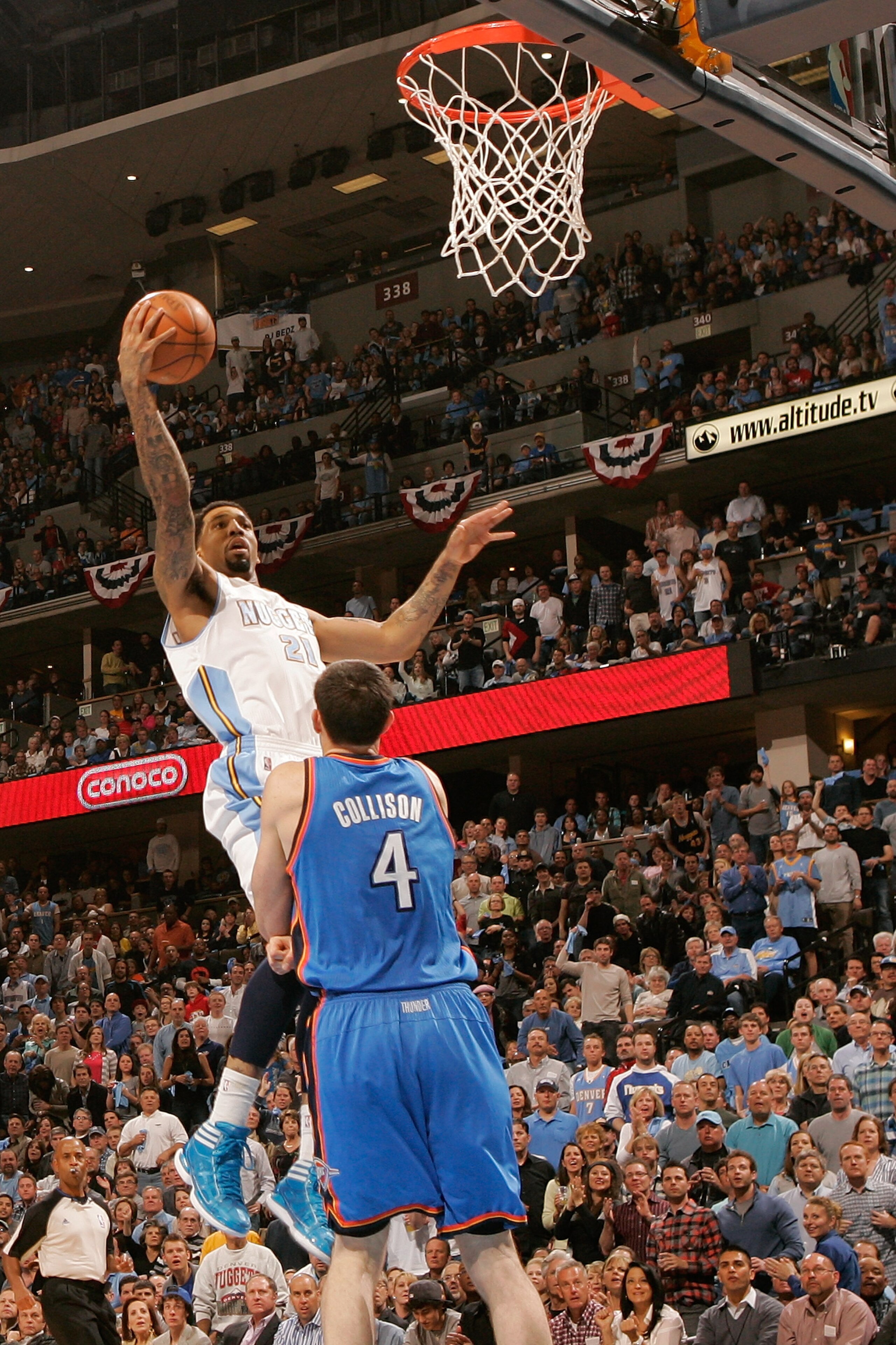 DENVER, CO - APRIL 23:  Wilson Chandler #21 of the Denver Nuggets goes up for a layup against Nick Collison #4 of the Oklahoma City Thunder during the first half of Game Three of the Western Conference Quarterfinals in the 2011 NBA Playoffs at Pepsi Cente