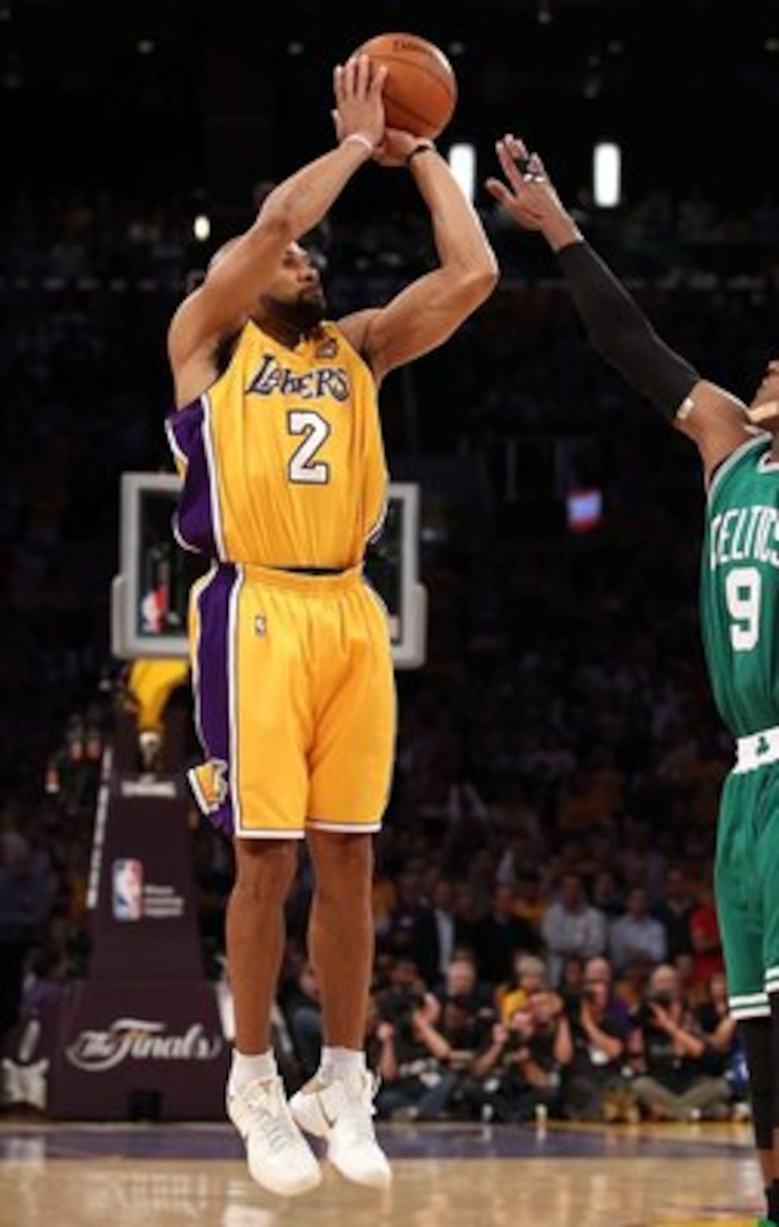 LOS ANGELES, CA - JUNE 17:  Derek Fisher #2 of the Los Angeles Lakers puts up a three point shot over Rajon Rondo #9 of the Boston Celtics in Game Seven of the 2010 NBA Finals at Staples Center on June 17, 2010 in Los Angeles, California.  The Lakers defe