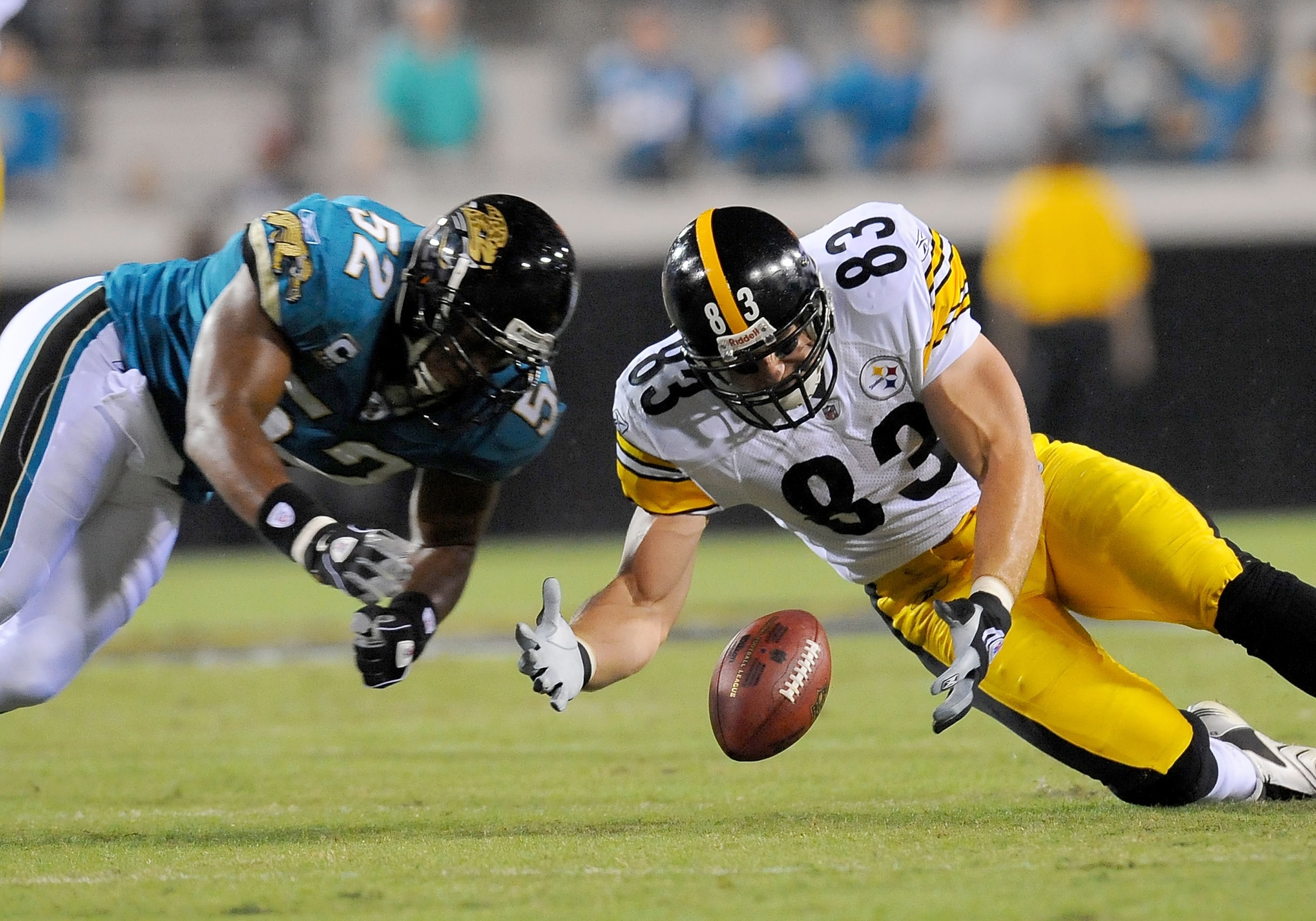 JACKSONVILLE, FL - OCTOBER 05:  Daryl Smith #52 of the Jacksonville Jaguars and Heath Miller #83 of the Pittsburgh Steelers scramble for a loose ball at Jacksonville Municipal Stadium on October 5, 2008 in Jacksonville, Florida.  (Photo by Sam Greenwood/G