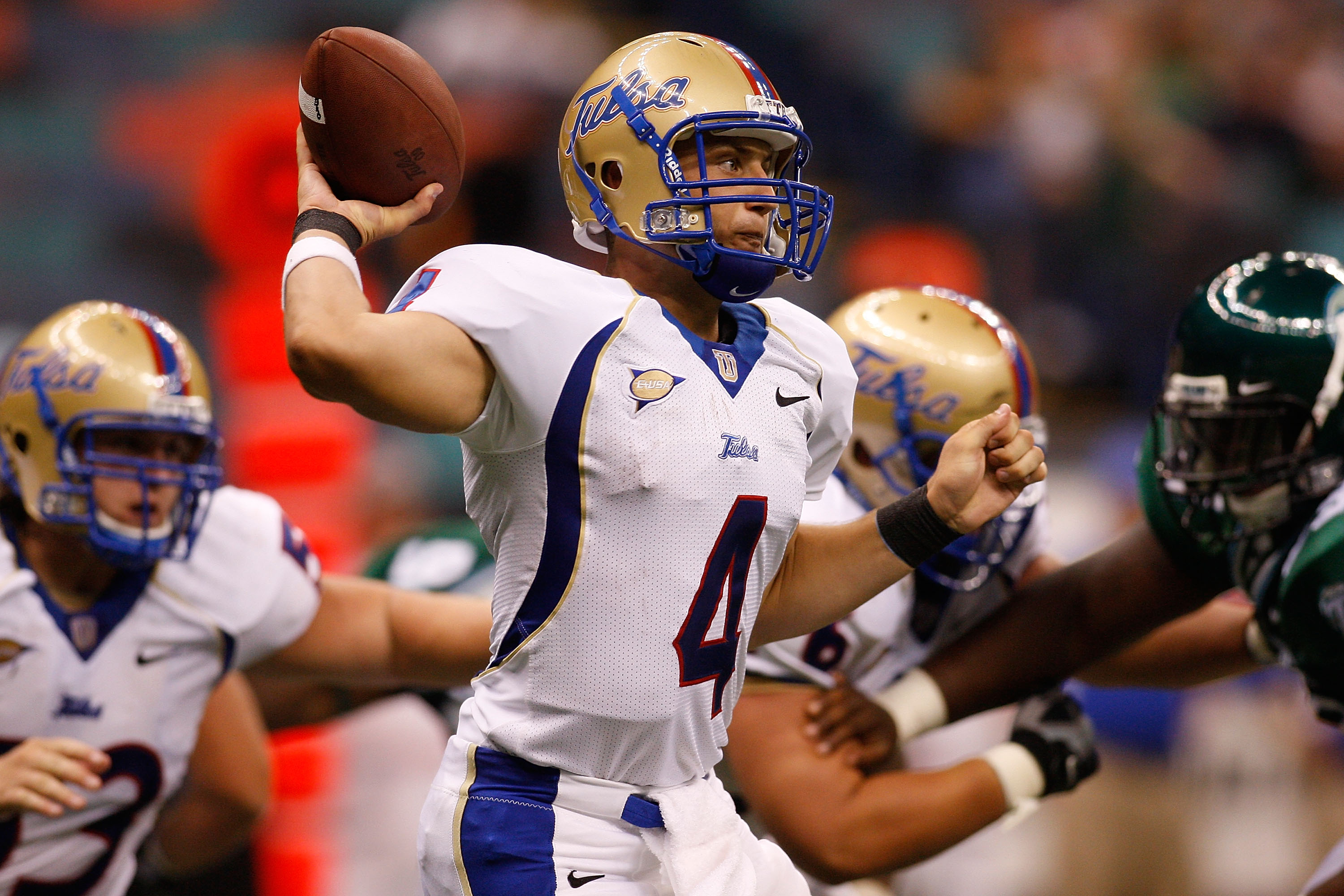 NEW ORLEANS - SEPTEMBER 04:  Quarterback G.J. Kinne #4 of the Tulsa Golden Hurricanes throws a pass against the Tulane Green Wave at the Louisiana Superdome on September 4, 2009 in New Orleans, Louisiana.   The Hurricanes defeated the Green Wave 37-13.  (