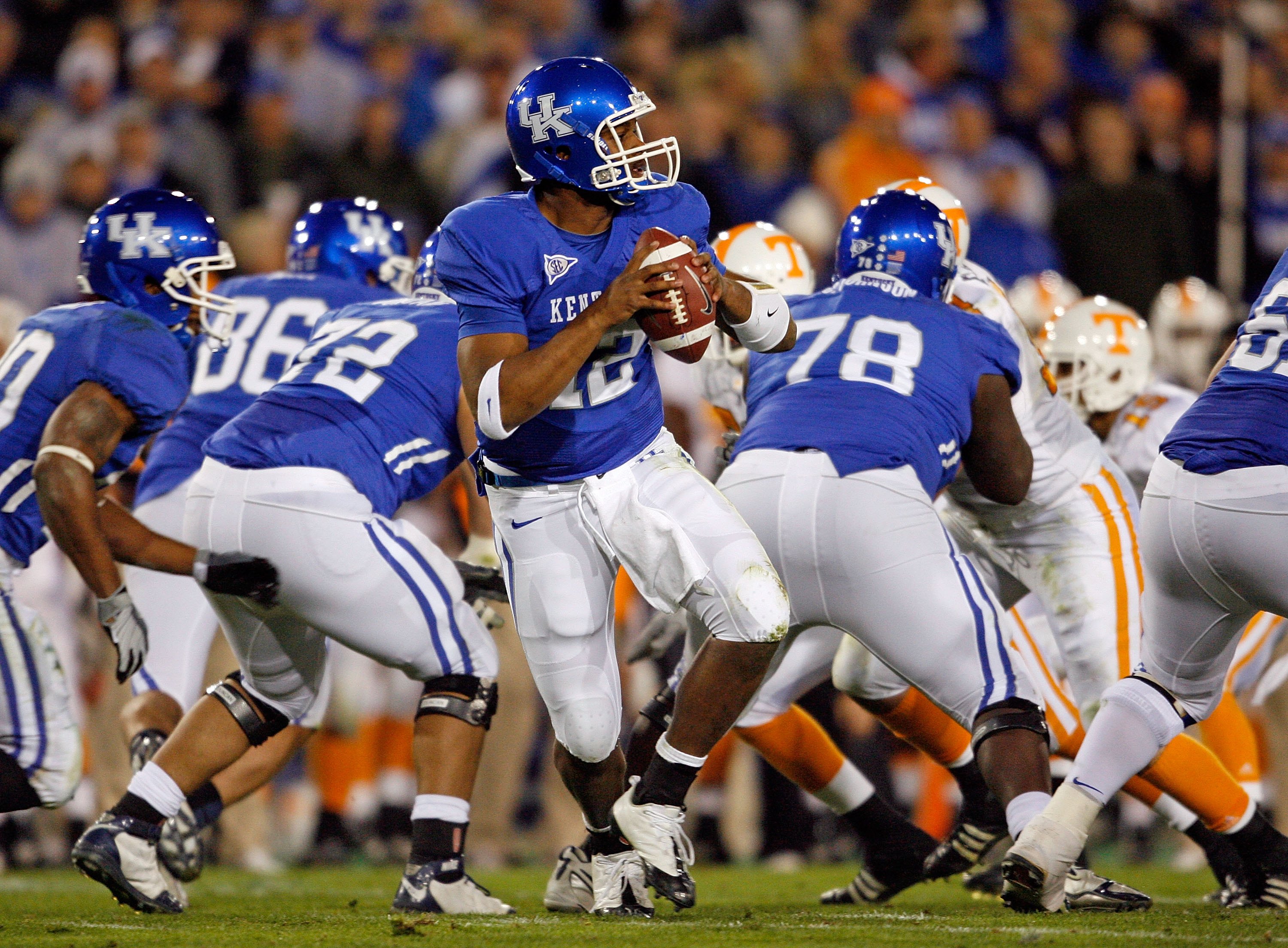 LEXINGTON, KY - NOVEMBER 28:  Morgan Newton #12 of the Kentucky Wildcats throws the ball against the Tennessee Volunteers during the SEC game at Commonwealth Stadium on November 28, 2009 in Lexington, Kentucky.  (Photo by Andy Lyons/Getty Images)