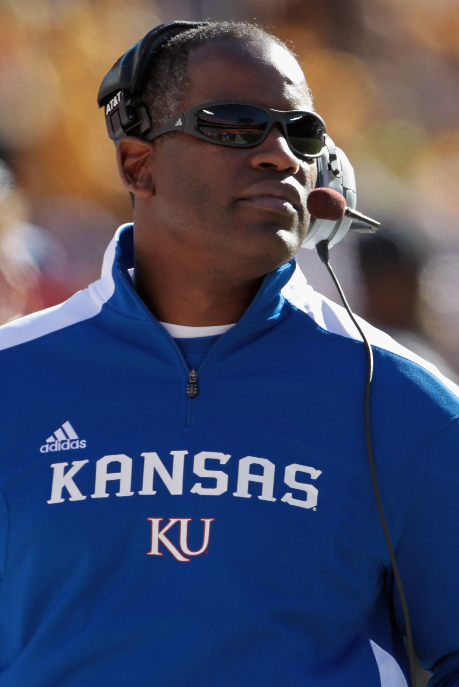 KANSAS CITY, MO - NOVEMBER 27:  Head coach Turner Gill of the Kansas Jayhawks coaches from the sidelines during the game against the Missouri Tigers on November 27, 2010 at Arrowhead Stadium in Kansas City, Missouri.  (Photo by Jamie Squire/Getty Images)