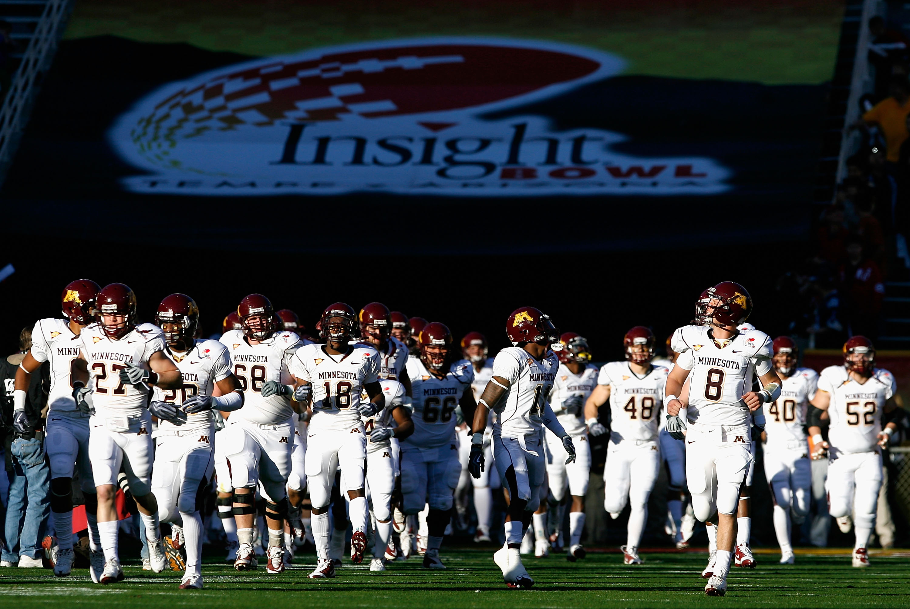 TEMPE, AZ - DECEMBER 31:  The Minnesota Golden Gophers run out onto the field before the Insight Bowl against the Iowa State Cyclones at Arizona Stadium on December 31, 2009 in Tempe, Arizona.  (Photo by Christian Petersen/Getty Images)