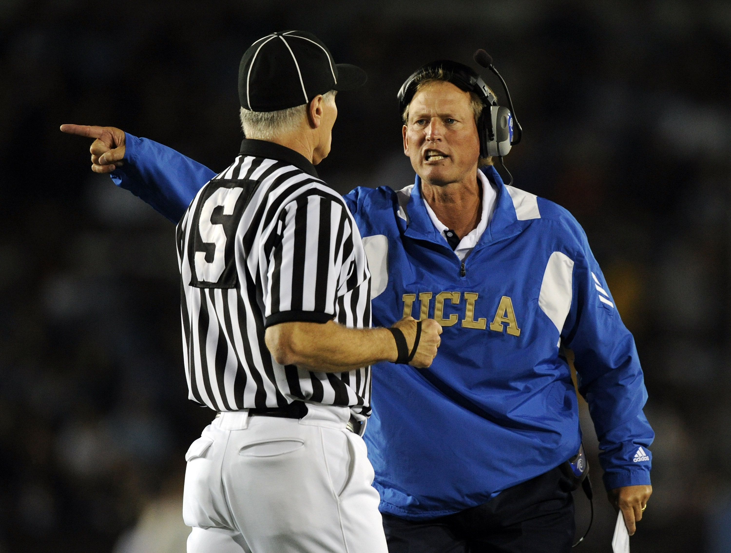 PASADENA, CA - SEPTEMBER 11:  Head Coach Rick Neuheisel of UCLA yells at the referee during the second quarter against Stanford at the Rose Bowl on September 11, 2010 in Pasadena, California.  (Photo by Harry How/Getty Images)