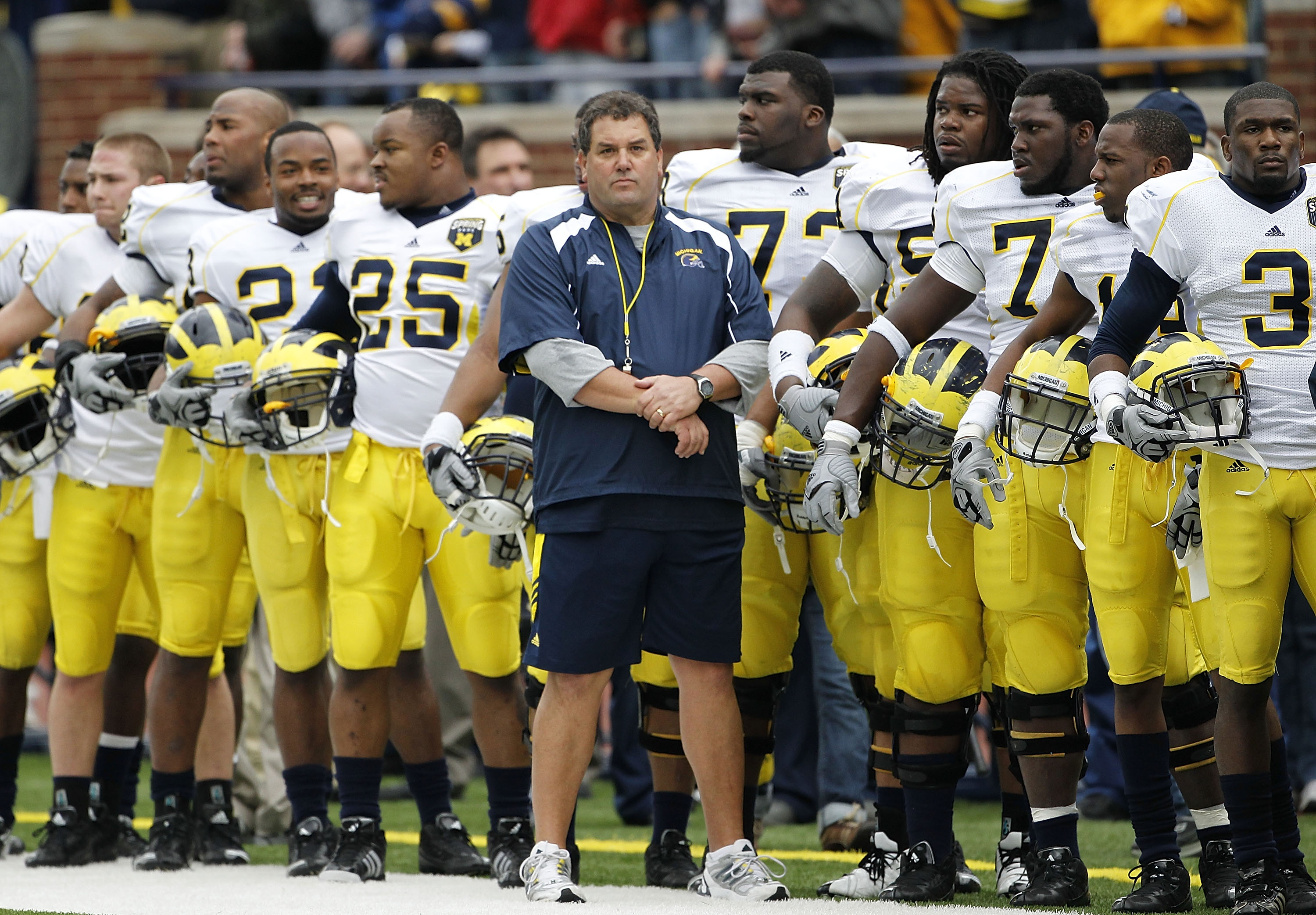 ANN ARBOR, MI - APRIL 16:  Head football coach Brady Hoke stands with his team prior to the start of the annual Spring Game at Michigan Stadium on April 16, 2011 in Ann Arbor, Michigan.  (Photo by Leon Halip/Getty Images)