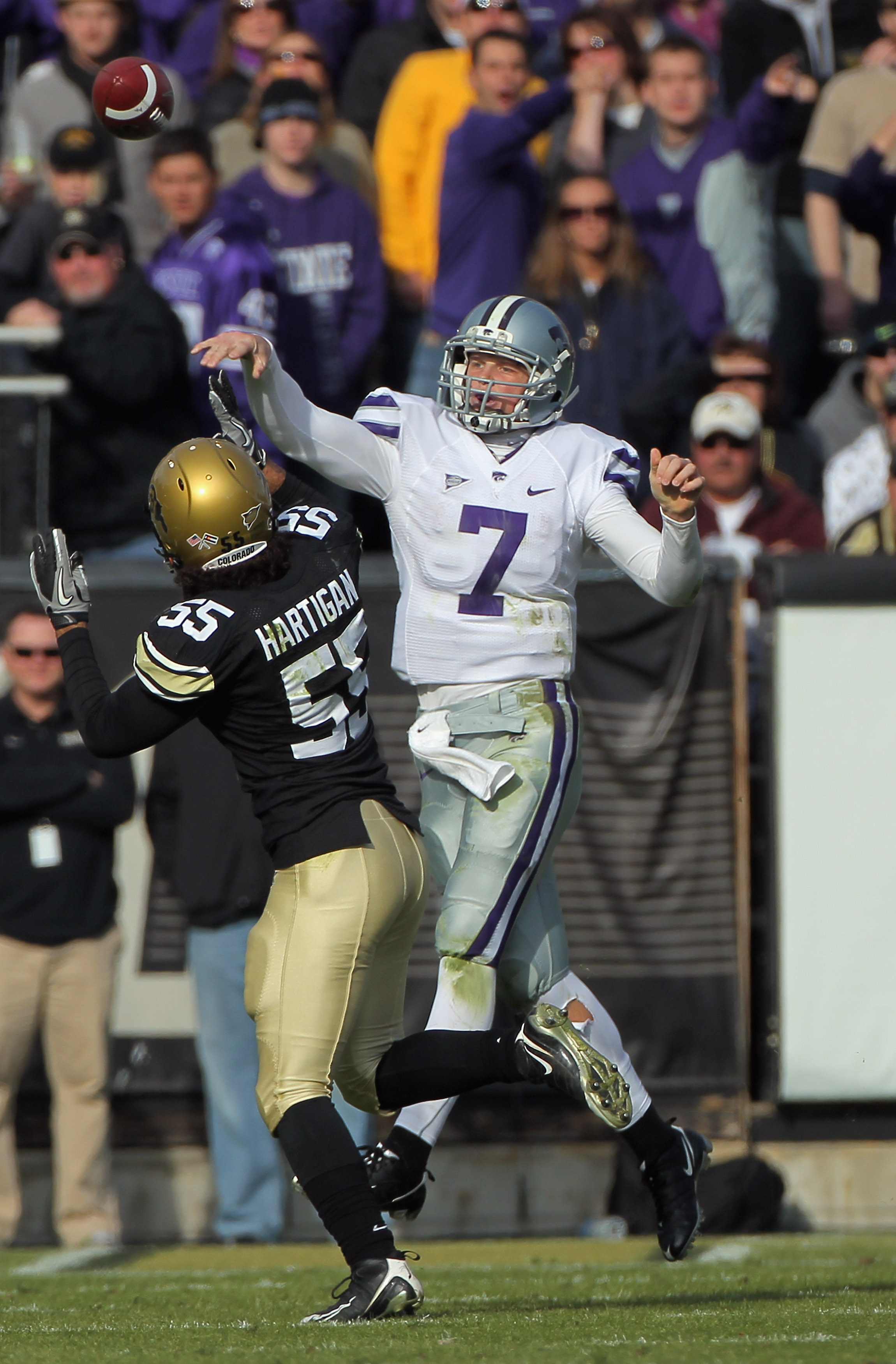 BOULDER, CO - NOVEMBER 20:  Quarterback Collin Klein #7 of the Kansas State Wildcats delivers a pass agsinst the defense of Josh Hartigan #55 of the Colorado Buffaloes at Folsom Field on November 20, 2010 in Boulder, Colorado. Colorado defeated Kansas Sta