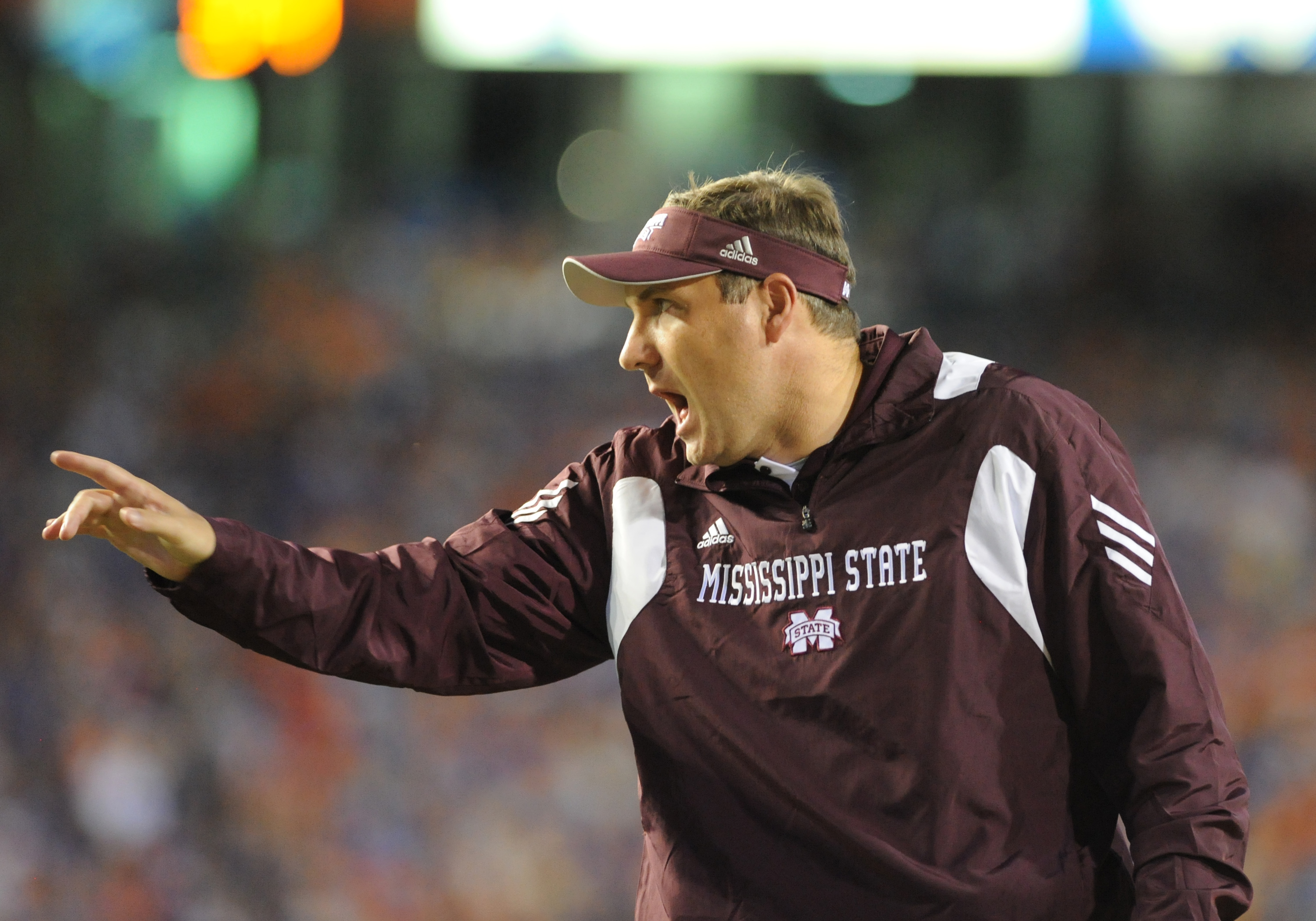 GAINESVILLE, FL - OCTOBER 16:  Coach Dan Mullen of the Mississippi State Bulldogs directs play against the Florida Gators  October 16, 2010 Ben Hill Griffin Stadium at Gainesville, Florida.  (Photo by Al Messerschmidt/Getty Images)