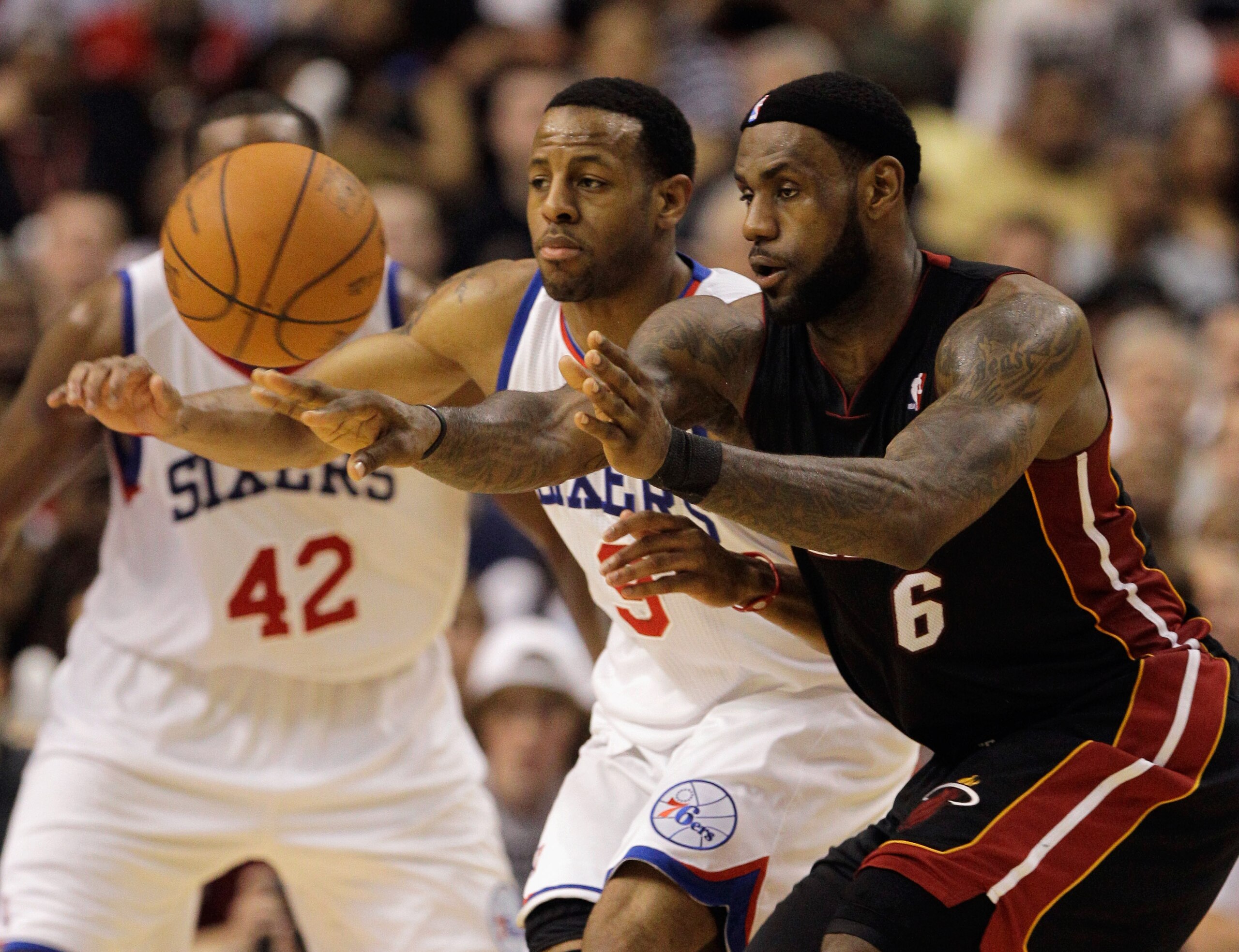 PHILADELPHIA, PA - APRIL 24:  LeBron James #6 of the Miami Heat passes the ball in front of Andre Iguodala #9 of the Philadelphia 76ers during the second half in Game Four of the Eastern Conference Quarterfinals in the 2011 NBA Playoffs at Wells Fargo Cen