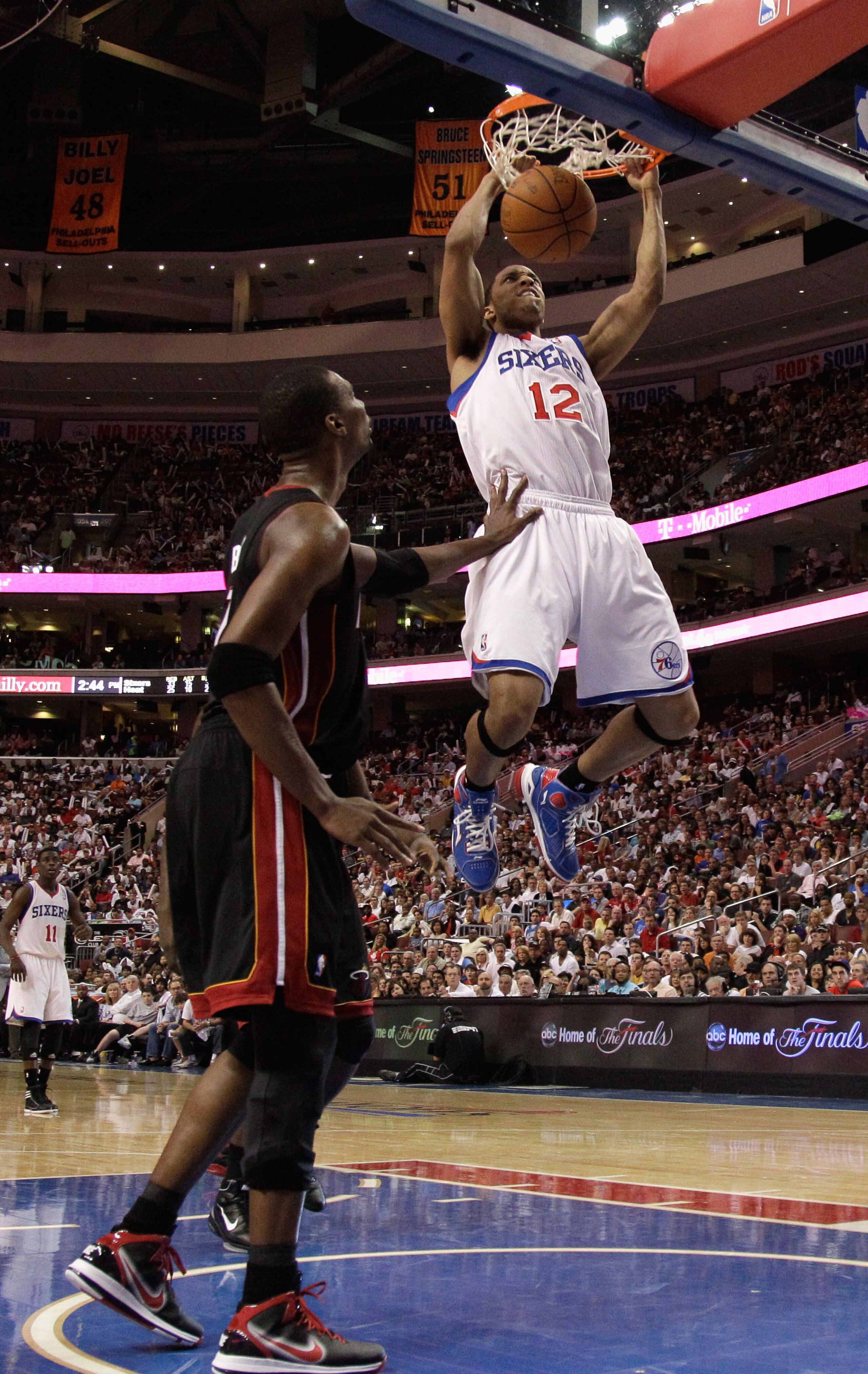 PHILADELPHIA, PA - APRIL 24: Evan Turner #12 of the Philadelphia 76ers dunks in front of Chris Bosh #1 of the Miami Heat during the second half of Game Four of the Eastern Conference Quarterfinals in the 2011 NBA Playoffs at Wells Fargo Center on April 24