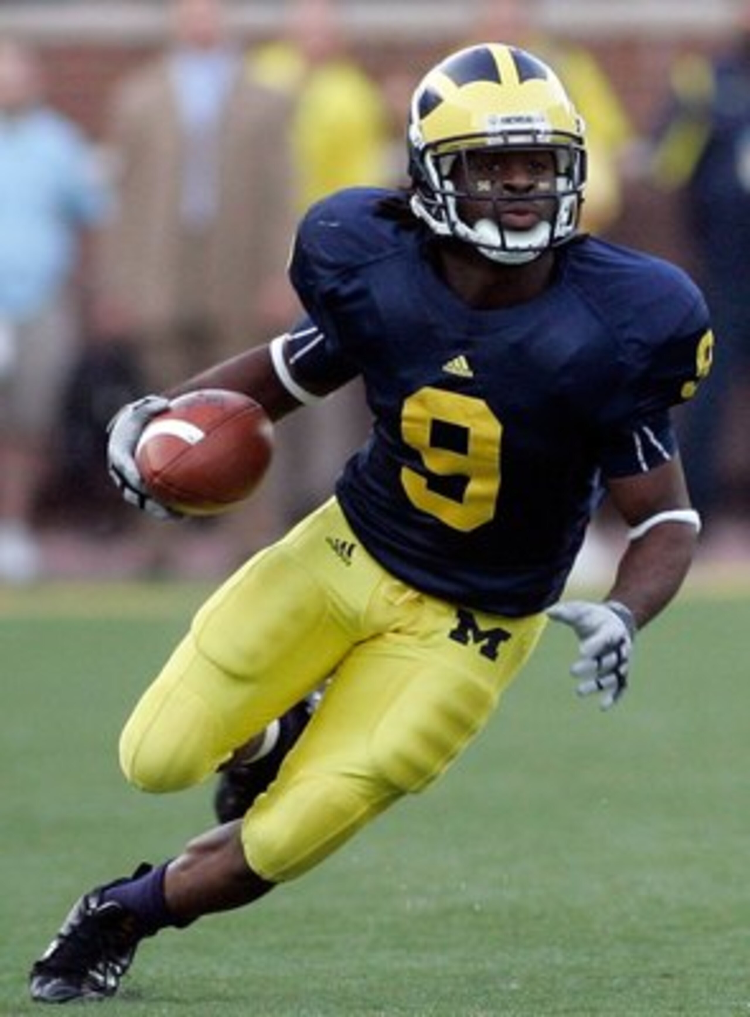 ANN ARBOR, MI - SEPTEMBER 12:  Martavious Odoms #9 of Michigan runs with the ball against Notre Dame at Michigan Stadium on September 12, 2009 in Ann Arbor, Michigan.  (Photo by Domenic Centofanti/Getty Images)