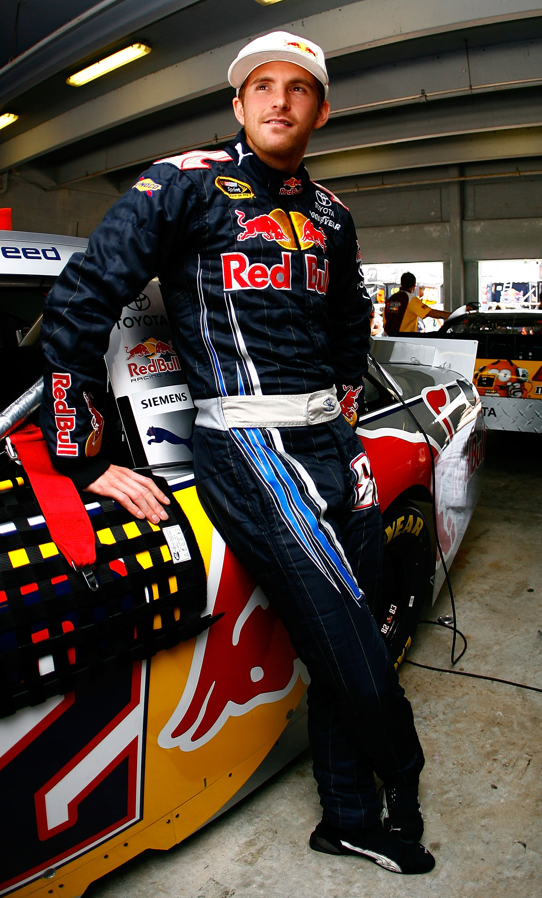 HOMESTEAD, FL - NOVEMBER 20:  Scott Speed, driver of the #82 Red Bull Toyota, stands in the garage during practice for the NASCAR Sprint Cup Series Ford 400 at Homestead-Miami Speedway on November 20, 2010 in Homestead, Florida.  (Photo by Jason Smith/Get