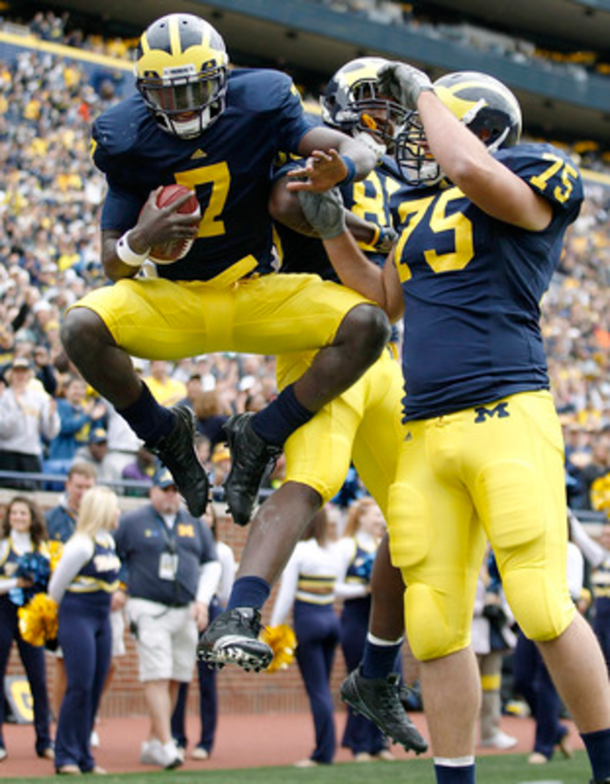 ANN ARBOR, MI - SEPTEMBER 25: Devin Gardner #7 celebrates a fourth quarter touchdown during the game against Bowling Green on September 25, 2010 at Michigan Stadium in Ann Arbor, Michigan. Michigan defeated Bowling Green65-21.  (Photo by Leon Halip/Getty 