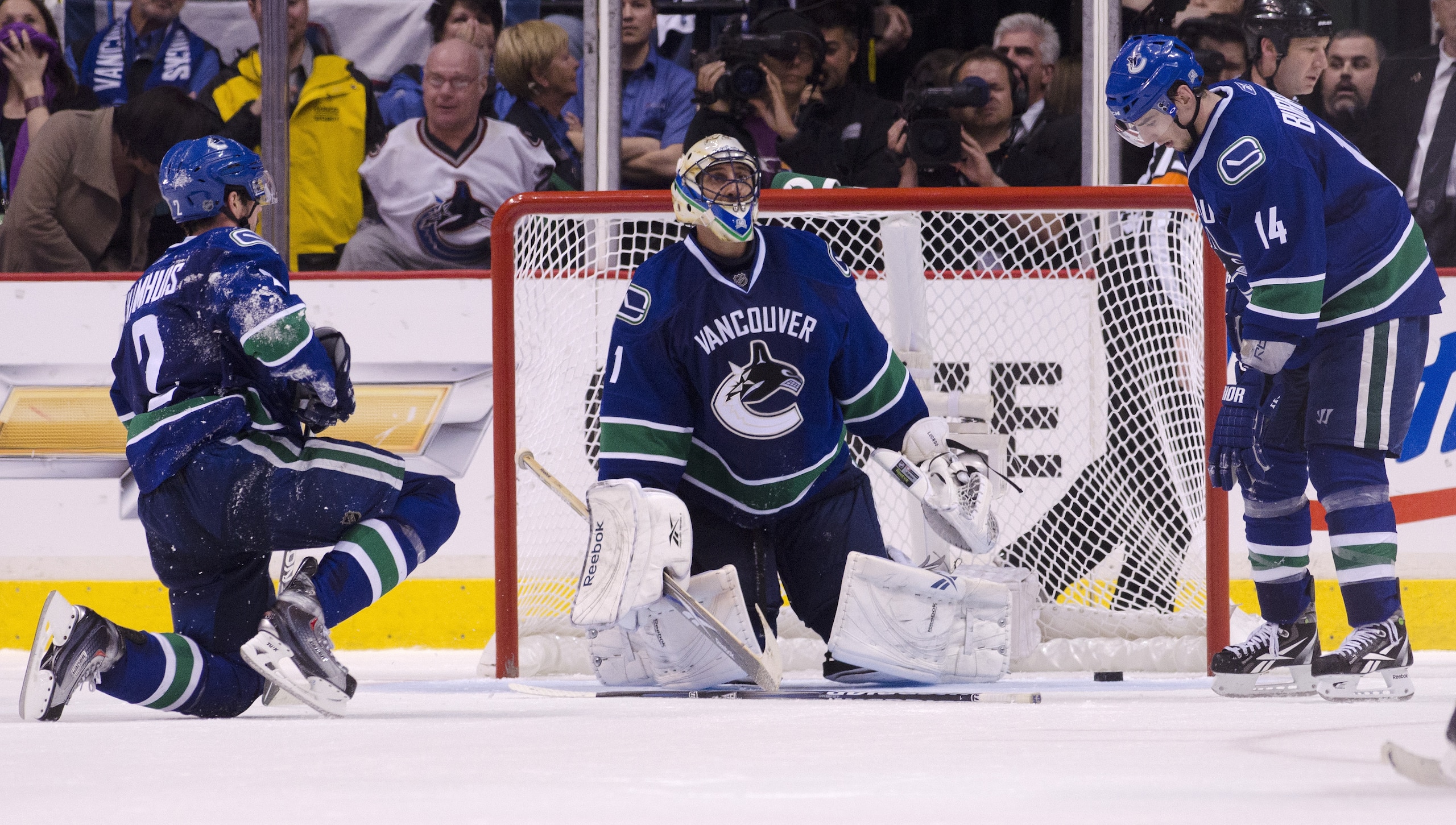 VANCOUVER, CANADA - APRIL 26: Dan Hamhuis #2, goalie Roberto Luongo #1 and Alexandre Burrows #14 of the Vancouver Canucks sit dejectedly on the ice after Jonathan Toews #19 of the Chicago Blackhawks (not pictured) scored the game tieing goal during the th VANCOUVER, CANADA - APRIL 26: Dan Hamhuis #2, goalie Roberto Luongo #1 and Alexandre Burrows #14 of the Vancouver Canucks sit dejectedly on the ice after Jonathan Toews #19 of the Chicago Blackhawks (not pictured) scored the game tieing goal during the th
