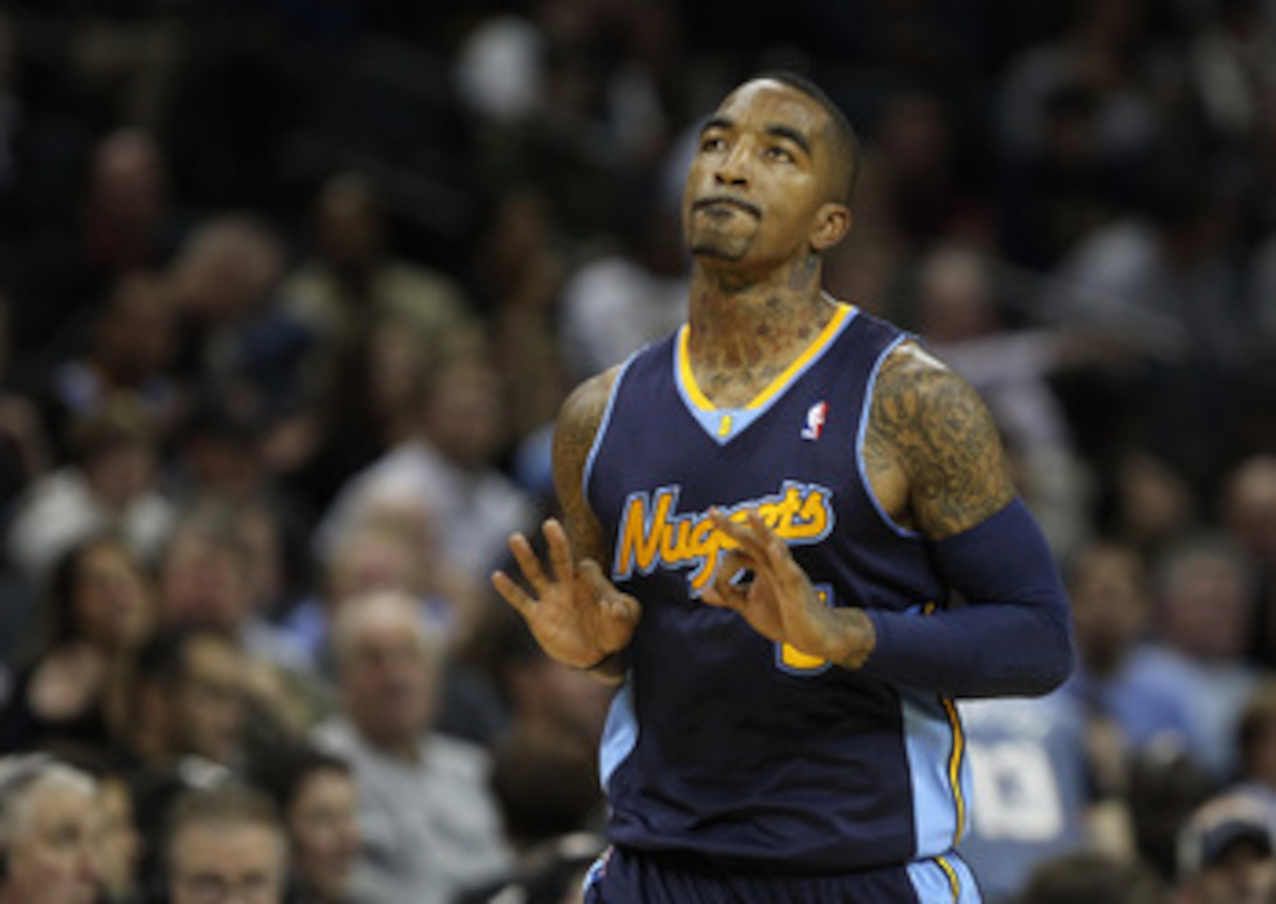 CHARLOTTE, NC - DECEMBER 07: J.R. Smith #5 of the Denver Nuggets celebrates after making a basket against the Charlotte Bobcats during their game at Time Warner Cable Arena on December 7, 2010 in Charlotte, North Carolina. NOTE TO USER: User expressly a CHARLOTTE, NC - DECEMBER 07: J.R. Smith #5 of the Denver Nuggets celebrates after making a basket against the Charlotte Bobcats during their game at Time Warner Cable Arena on December 7, 2010 in Charlotte, North Carolina. NOTE TO USER: User expressly a