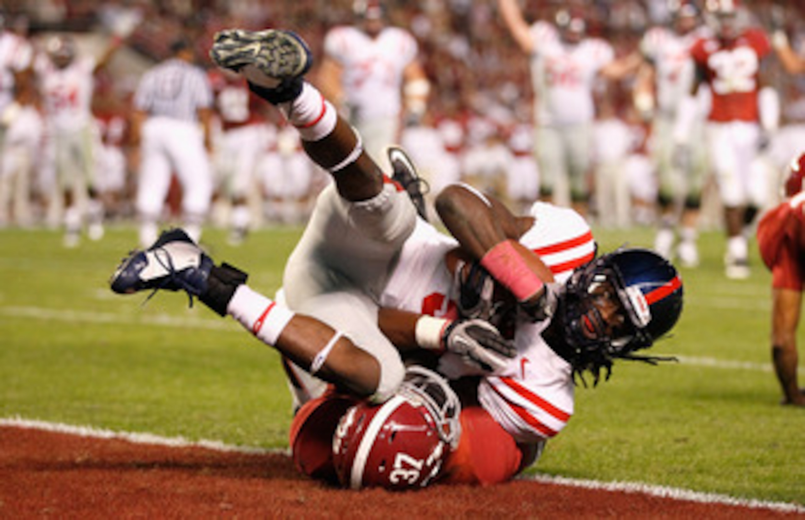 TUSCALOOSA, AL - OCTOBER 16:  Melvin Harris #5 of the Ole Miss Rebels scores a touchdown over Robert Lester #37 of the Alabama Crimson Tide at Bryant-Denny Stadium on October 16, 2010 in Tuscaloosa, Alabama.  (Photo by Kevin C. Cox/Getty Images)