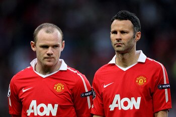MANCHESTER, ENGLAND - APRIL 12:  Wayne Rooney (L) and Ryan Giggs of Manchester United line up prior to the UEFA Champions League Quarter Final second leg match between Manchester United and Chelsea at Old Trafford on April 12, 2011 in Manchester, England.