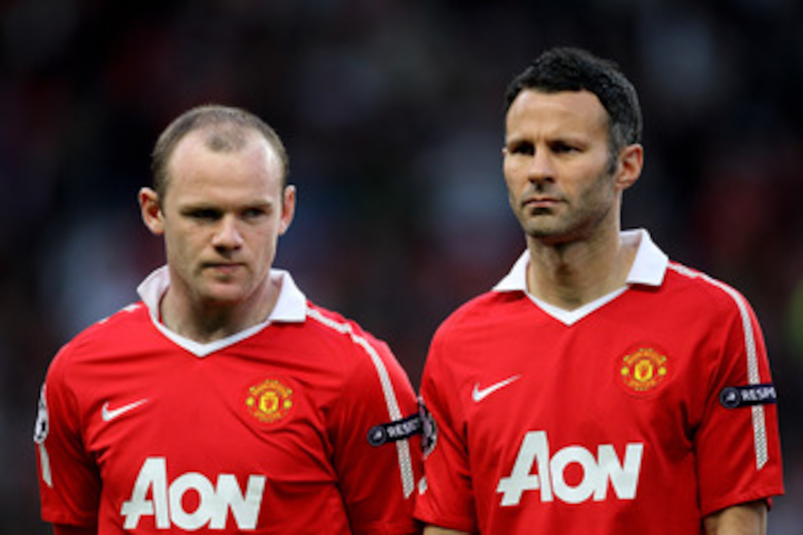 MANCHESTER, ENGLAND - APRIL 12: Wayne Rooney (L) and Ryan Giggs of Manchester United line up prior to the UEFA Champions League Quarter Final second leg match between Manchester United and Chelsea at Old Trafford on April 12, 2011 in Manchester, England. MANCHESTER, ENGLAND - APRIL 12: Wayne Rooney (L) and Ryan Giggs of Manchester United line up prior to the UEFA Champions League Quarter Final second leg match between Manchester United and Chelsea at Old Trafford on April 12, 2011 in Manchester, England.