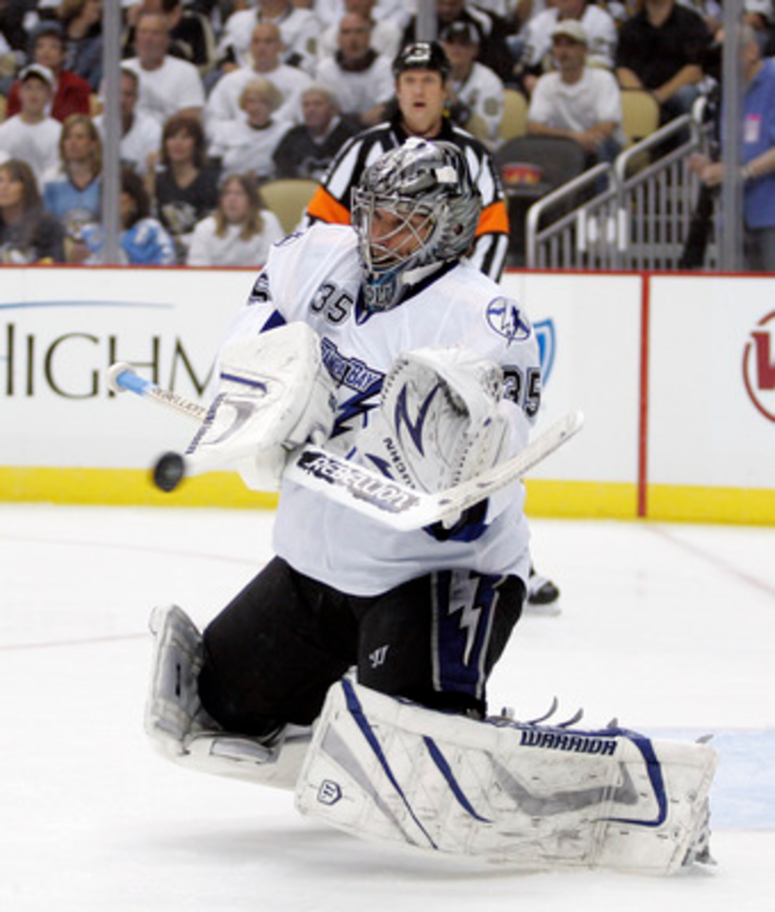 PITTSBURGH, PA - APRIL 27:  Dwayne Roloson #35 of the Tampa Bay Lightning makes a save against the Pittsburgh Penguins in Game Seven of the Eastern Conference Quarterfinals during the 2011 NHL Stanley Cup Playoffs at Consol Energy Center on April 27, 2011