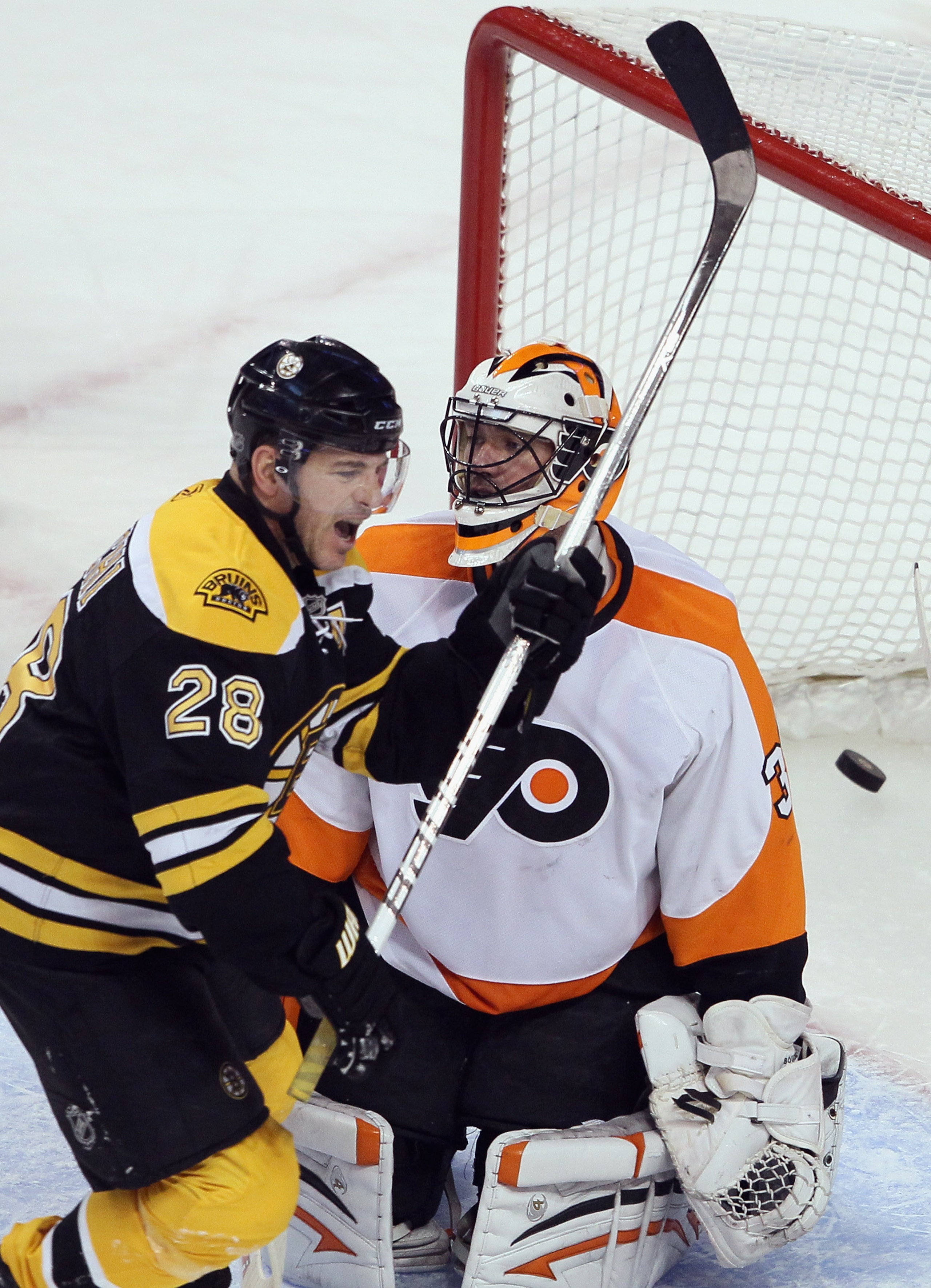 BOSTON, MA - JANUARY 13:  Mark Recchi #28 of the Boston Bruins celebrates teammate Zdeno Chara's goal in the first period as Brian Boucher #33 of the Philadelphia Flyers stands by on January 11, 2011 at the TD Garden in Boston, Massachusetts.  (Photo by E