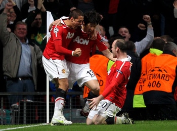 MANCHESTER, ENGLAND - APRIL 12:  Ji-Sung Park of Manchester United celebrates scoring his team's second goal with team mates Wayne Rooney (R) and Javier Hernandez (L) during the UEFA Champions League Quarter Final second leg match between Manchester Unite
