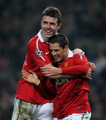 MANCHESTER, ENGLAND - MARCH 15:  Javier Hernandez (R) of Manchester United celebrates with teammate Michael Carrick as he scores the second goal during the UEFA Champions League round of 16 second leg match between Manchester United and Marseille at Old T