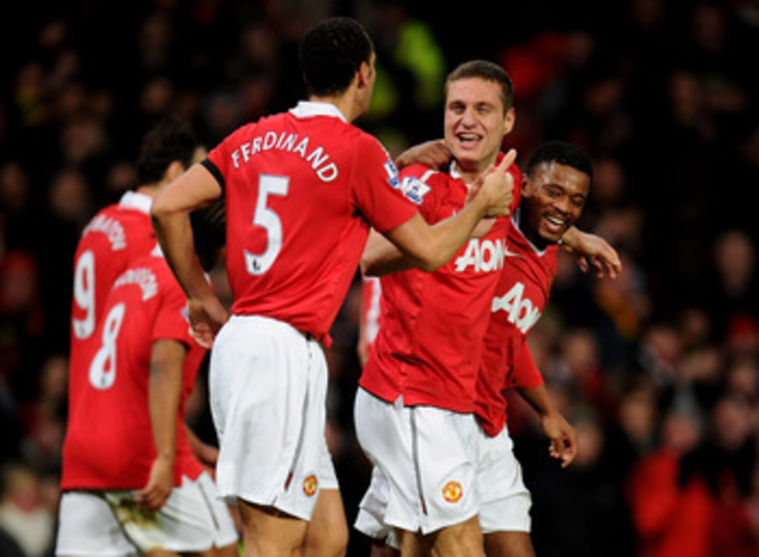 MANCHESTER, ENGLAND - FEBRUARY 01: Nemanja Vidic of Manchester United celebrates scoring his team's third goal with team mates Rio Ferdinand and Patrice Evra (R) during the Barclays Premier League match between Manchester United and Aston Villa at Old Tr MANCHESTER, ENGLAND - FEBRUARY 01: Nemanja Vidic of Manchester United celebrates scoring his team's third goal with team mates Rio Ferdinand and Patrice Evra (R) during the Barclays Premier League match between Manchester United and Aston Villa at Old Tr
