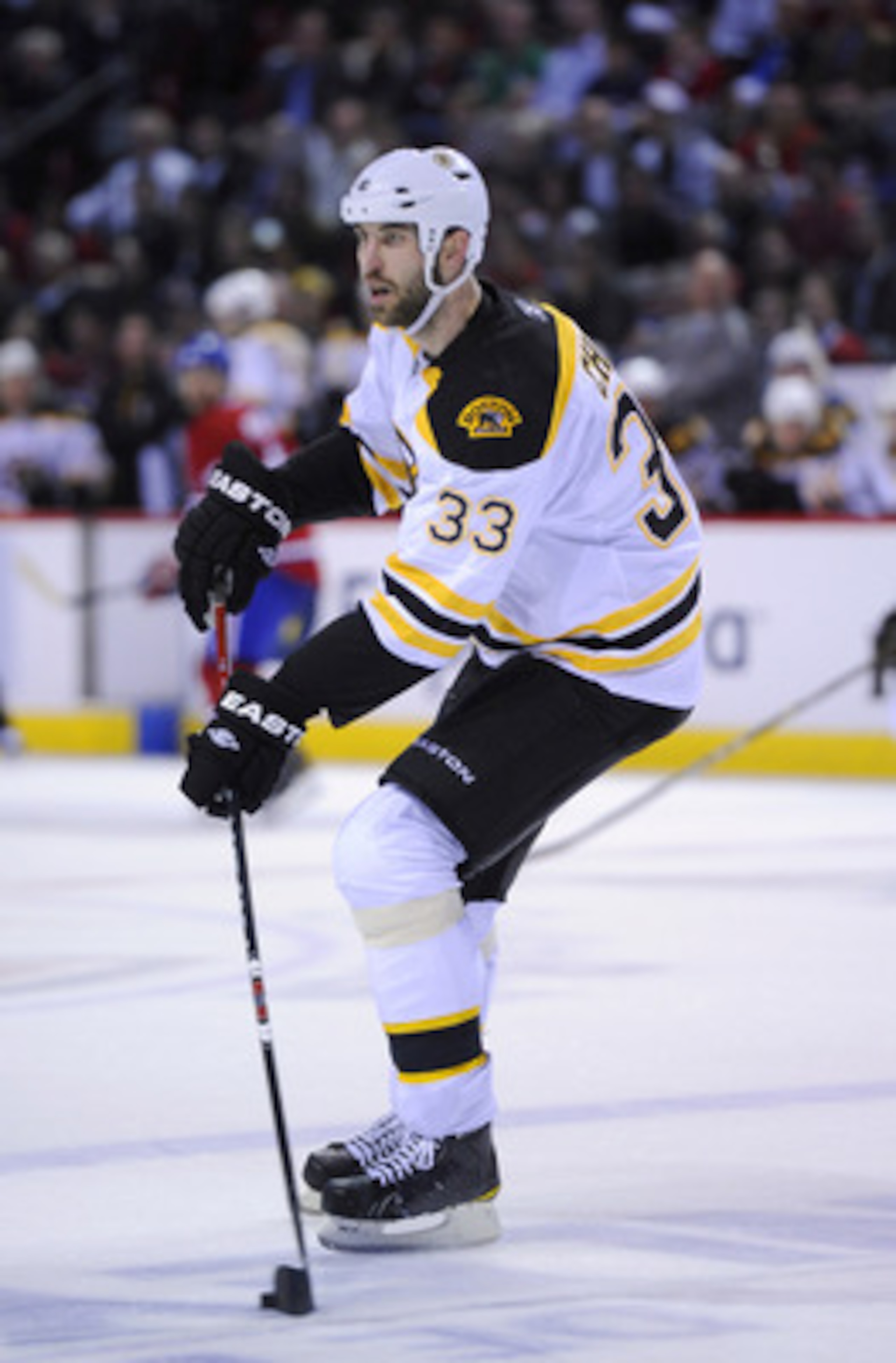 MONTREAL, CANADA - APRIL 26:  Zdeno Chara #33 of the Boston Bruins carries the puck up ice in Game Six of the Eastern Conference Quarterfinals against the Montreal Canadiens during the 2011 NHL Stanley Cup Playoffs at the Bell Centre on April 26, 2011 in