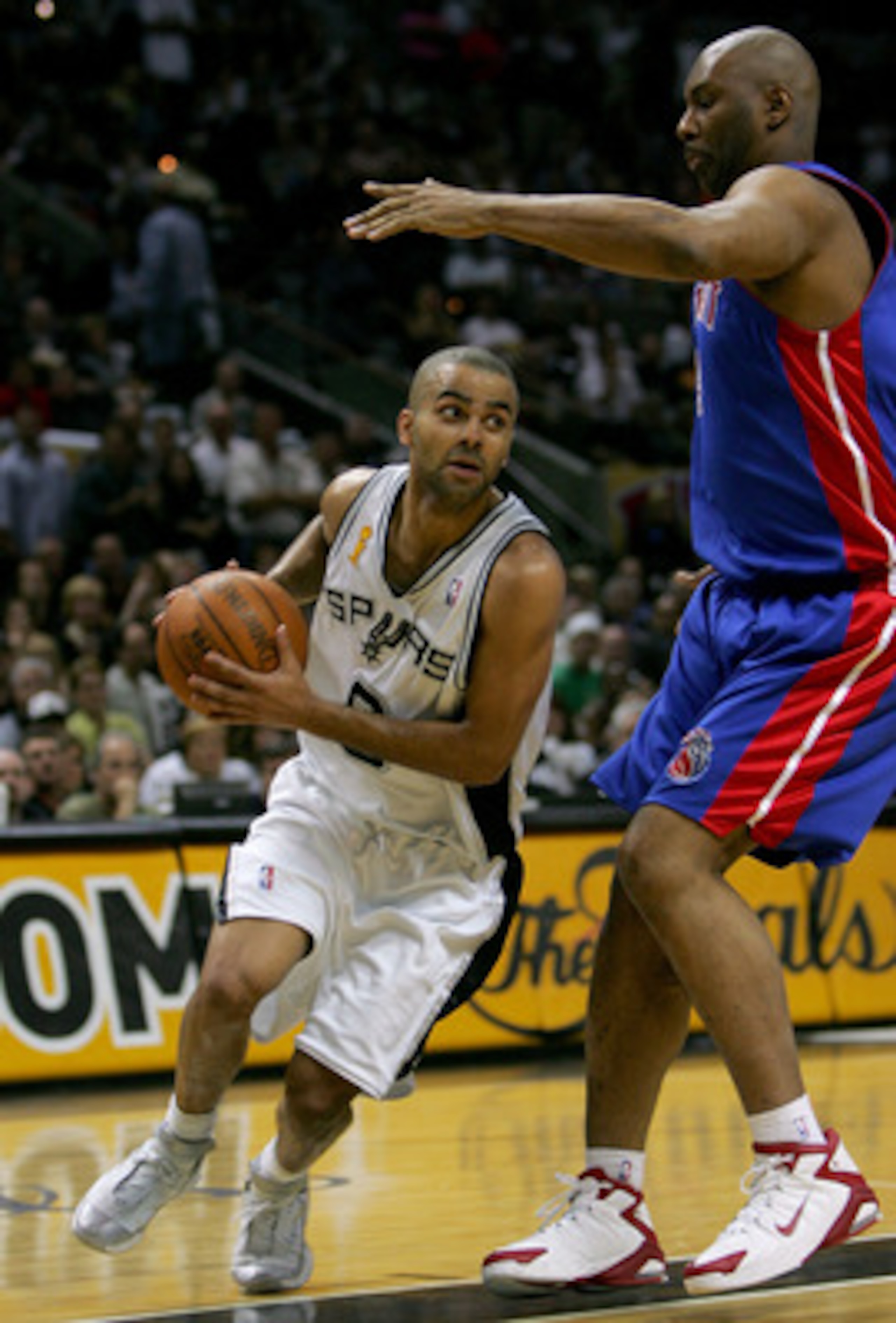 SAN ANTONIO - JUNE 23:  Tony Parker #9 of the San Antonio Spurs moves around Elden Campbell #41 of the Detroit Pistons in the first half of Game seven of the 2005 NBA Finals at SBC Center on June 23, 2005 in San Antonio, Texas.  NOTE TO USER: User express
