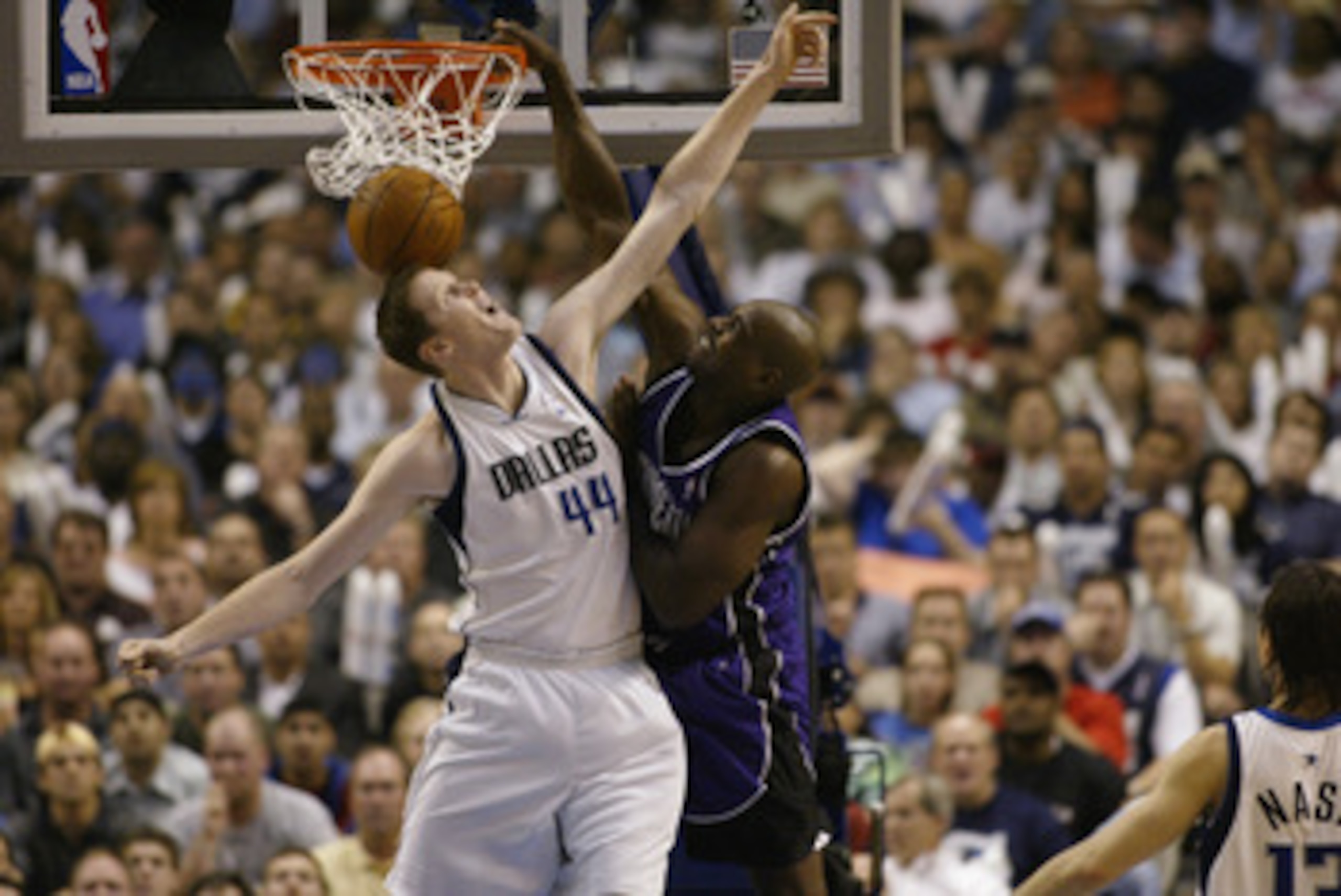DALLAS - MAY 6:  Chris Webber #4 of the Sacramento Kings dunks on Shawn Bradley #44 of the Dallas Mavericks in Game one of the Western Conference Semifinals during the 2003 NBA Playoffs at American Airlines Center on May 6, 2003 in Dallas, Texas.  The Kin
