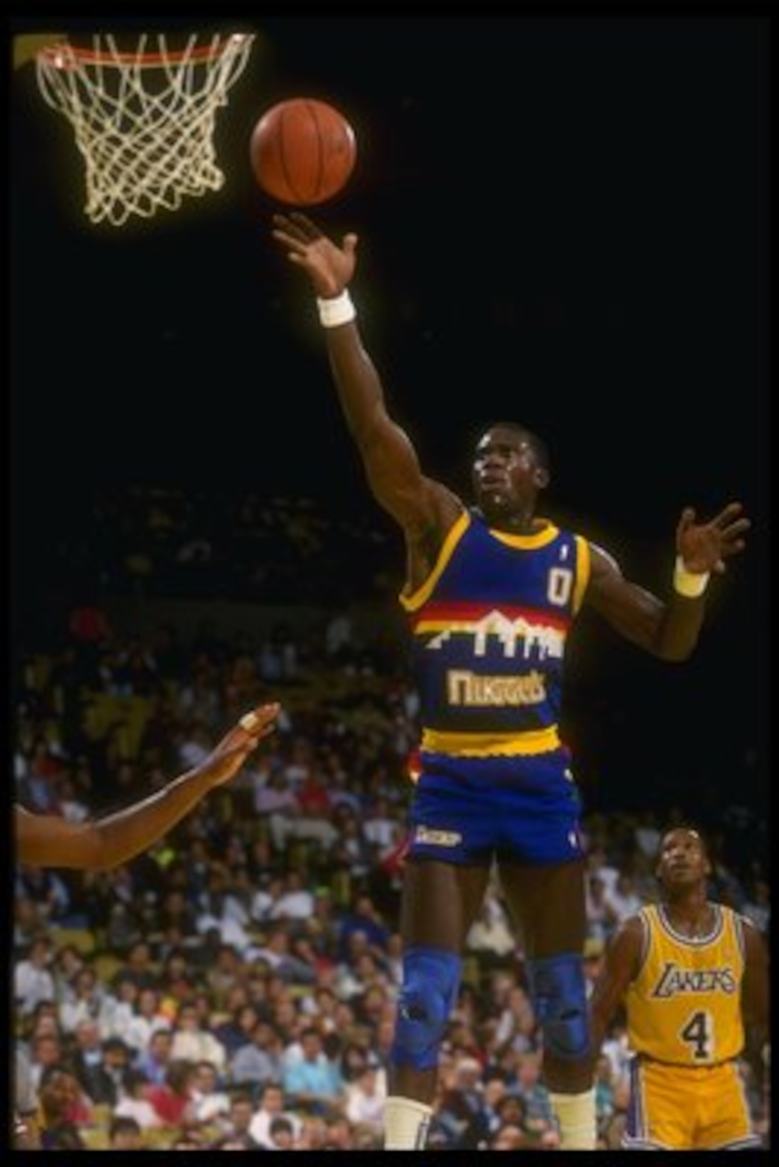 Forward Orlando Woolridge of the Denver Nuggets goes up for two during a game against the Los Angeles Lakers at Great Western Forum in Inglewood, California.