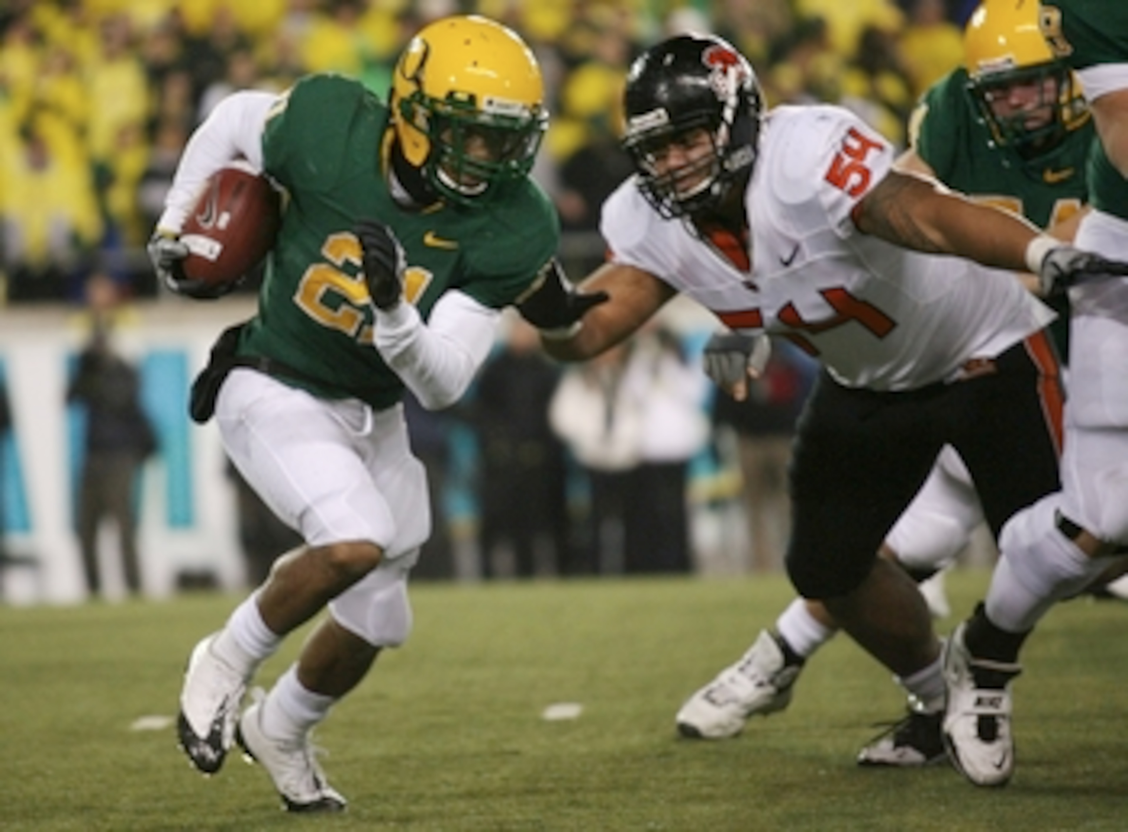 EUGENE, OR - DECEMBER 03: Running back LaMichael James #21 of the Oregon Ducks rushes with the ball past tackle Stephen Paea #54 of the Oregon State Beavers at Autzen Stadium on December 3, 2009 in Eugene, Oregon. (Photo by Tom Hauck/Getty Images) EUGENE, OR - DECEMBER 03: Running back LaMichael James #21 of the Oregon Ducks rushes with the ball past tackle Stephen Paea #54 of the Oregon State Beavers at Autzen Stadium on December 3, 2009 in Eugene, Oregon. (Photo by Tom Hauck/Getty Images)