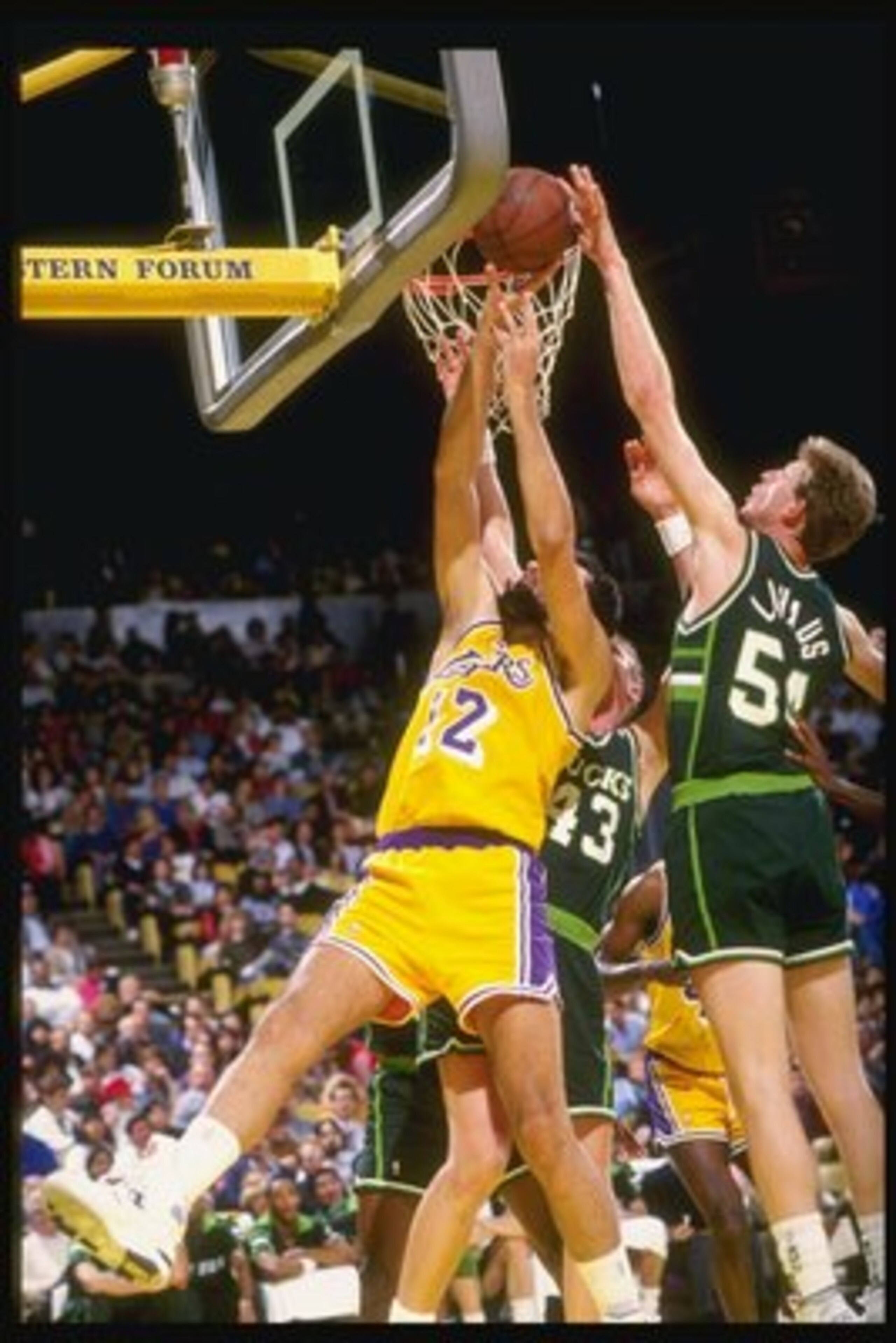 1990-1991:  Cenger Brad Lohaus of the Milwaukee Bucks (right) tries to block the shot of center Vlade Divac of the Los Angeles Lakers during a game at the Great Western Forum in Inglewood, California. Mandatory Credit: Stephen Dunn  /Allsport