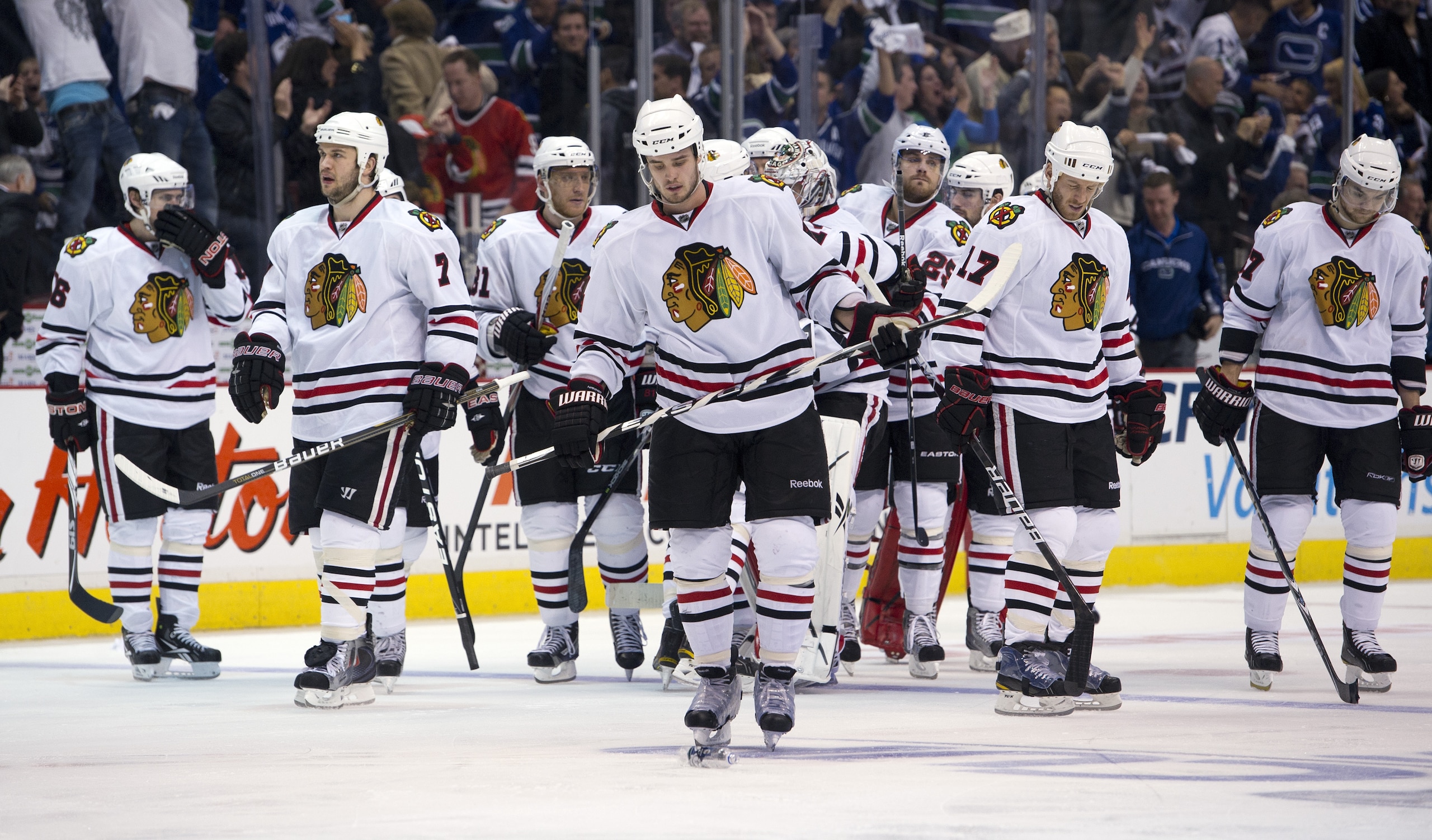 VANCOUVER, CANADA - APRIL 26: The Chicago Blackhawks wait dejectedly for the handshake with the Vancouver Canucks after losing 2-1 in overtime of Game Seven of the Western Conference Quarterfinals during the 2011 NHL Stanley Cup Playoffs on April 26, 2011