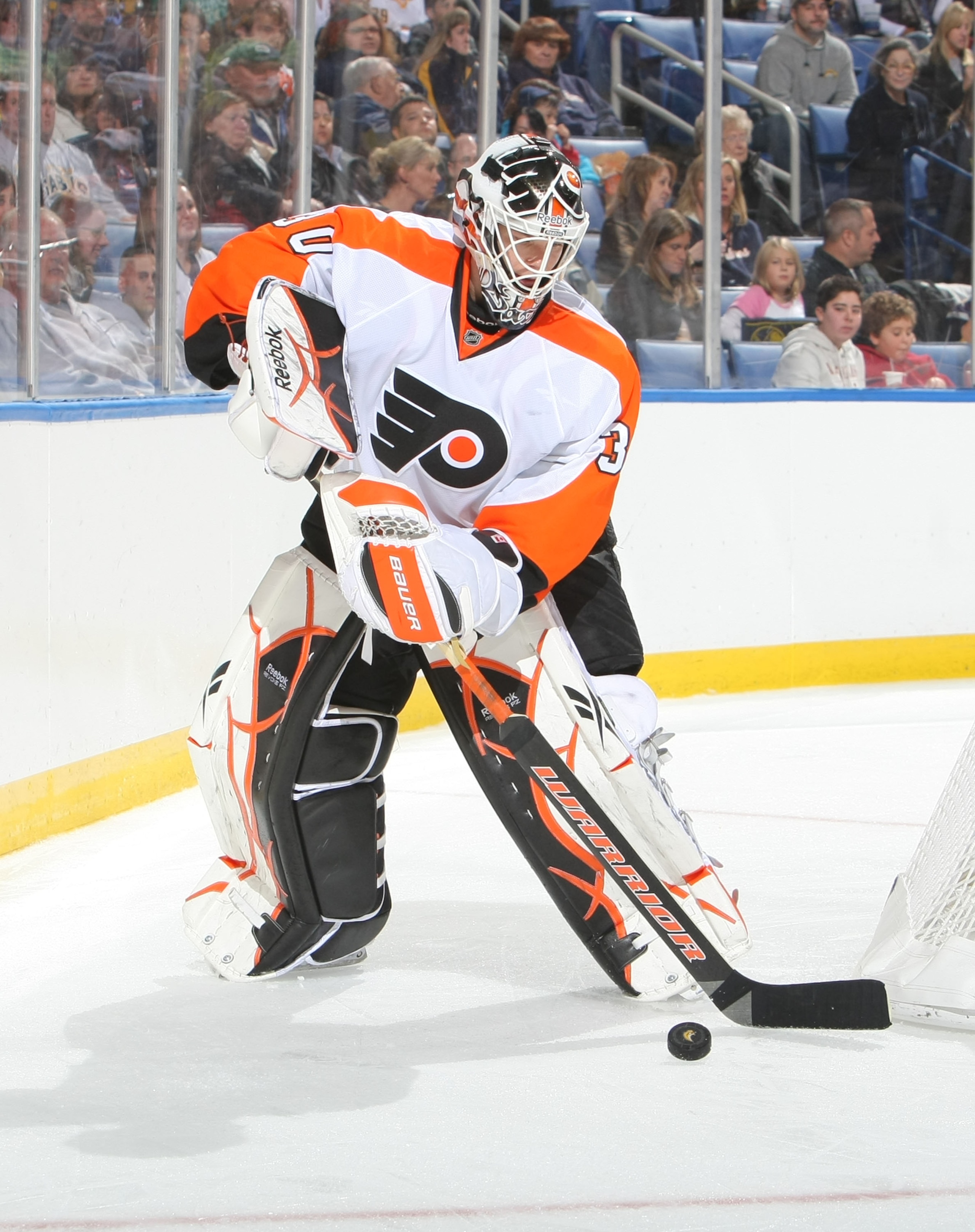 BUFFALO - OCTOBER 3:  Johan Backlund #30 of the Philadelphia Flyers plays the puck against the Buffalo Sabres during their NHL game at HSBC Arena October 3, 2010 in Buffalo, New York. The Sabres won 9-3. (Photo By Dave Sandford/Getty Images)