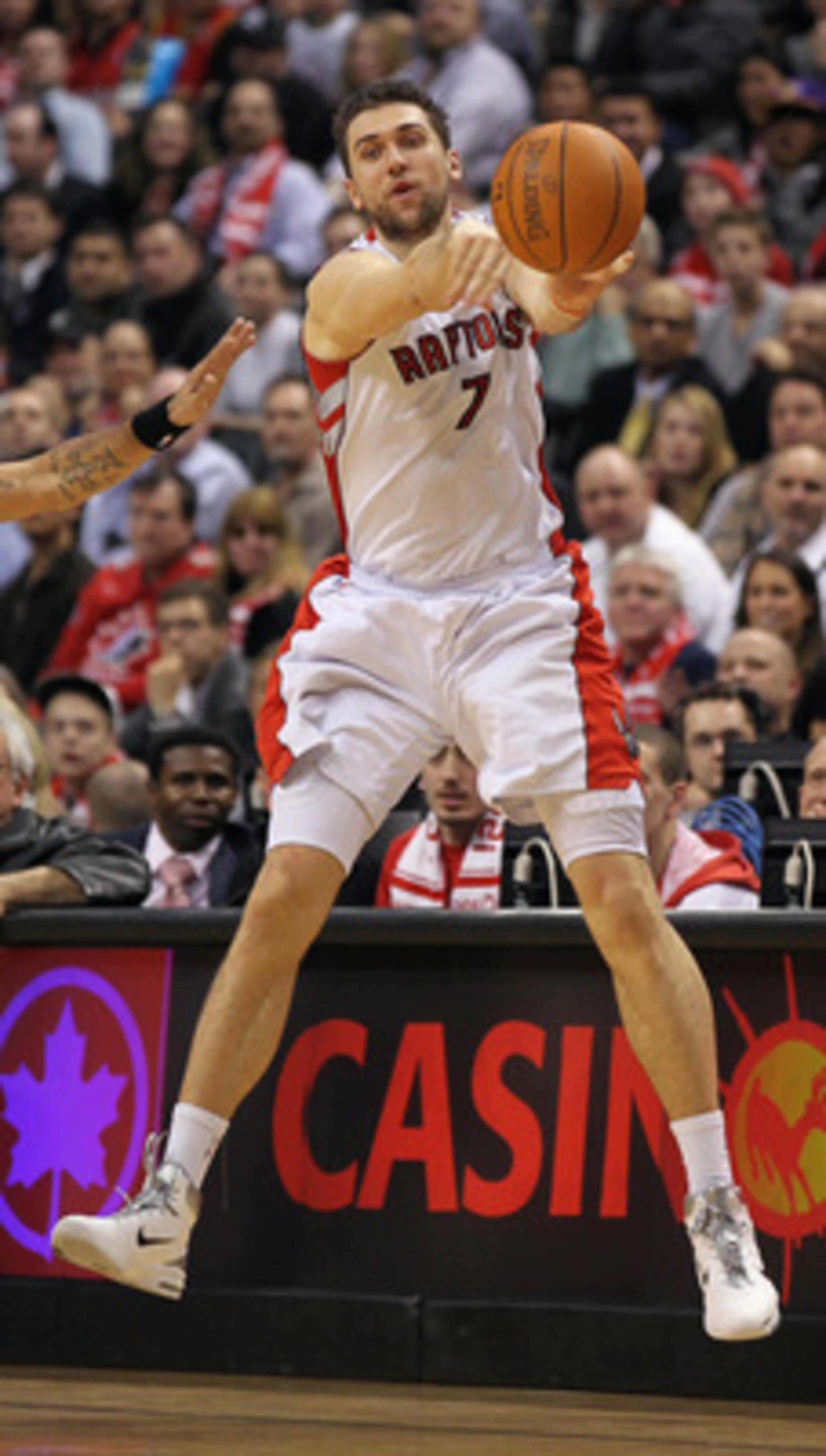 TORONTO, CANADA - FEBRUARY 16:  Andrea Bargnani #7 of the Toronto Raptors fires a pass in a game against the Miami Heat on February 16, 2011 at the Air Canada Centre in Toronto, Canada. The Heat defeated the Raptors 103-95. (Photo by Claus Andersen/Getty 