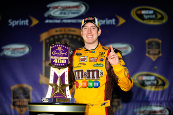 RICHMOND, VA - MAY 01:  Kyle Busch, driver of the #18 M&M's Toyota, celebrates with the trophy in victory lane after winning the NASCAR Sprint Cup Series Crown Royal Presents the Heath Calhoun 400 at Richmond International Raceway on May 1, 2010, 2010 in 
