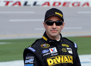 TALLADEGA, AL - APRIL 16:  Marcos Ambrose, driver of the #9 Dewalt Ford, stands on the grid during qualifying for the NASCAR Sprint Cup Series Aaron's 499 at Talladega Superspeedway on April 16, 2011 in Talladega, Alabama.  (Photo by Jason Smith/Getty Ima