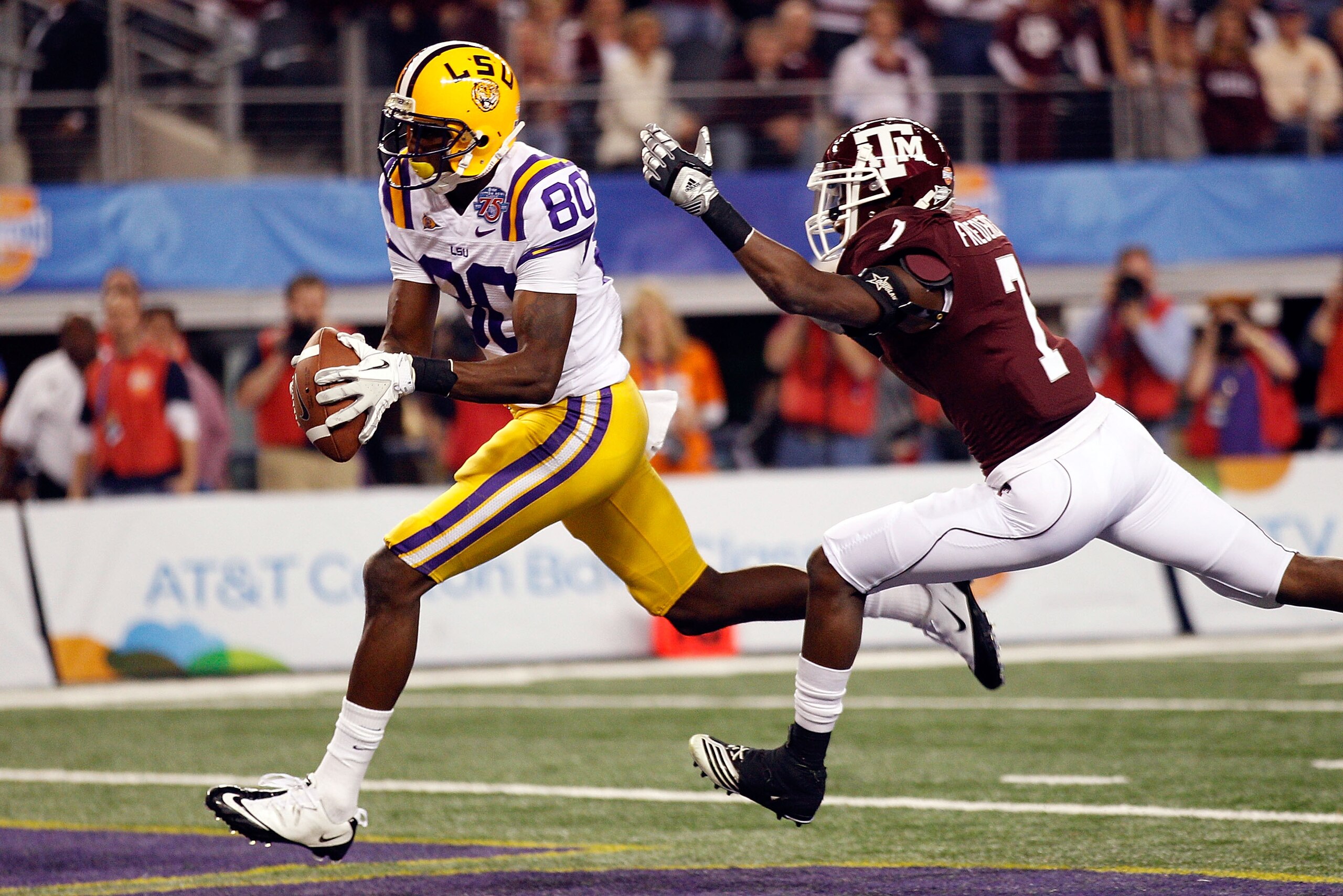 ARLINGTON, TX - JANUARY 07:  Terrence Toliver #80 of the Louisiana State University Tigers catches a touchdown pass over Terrence McCoy #7 of the Texas A&M Aggies during the AT&T Cotton Bowl at Cowboys Stadium on January 7, 2011 in Arlington, Texas.  (Pho
