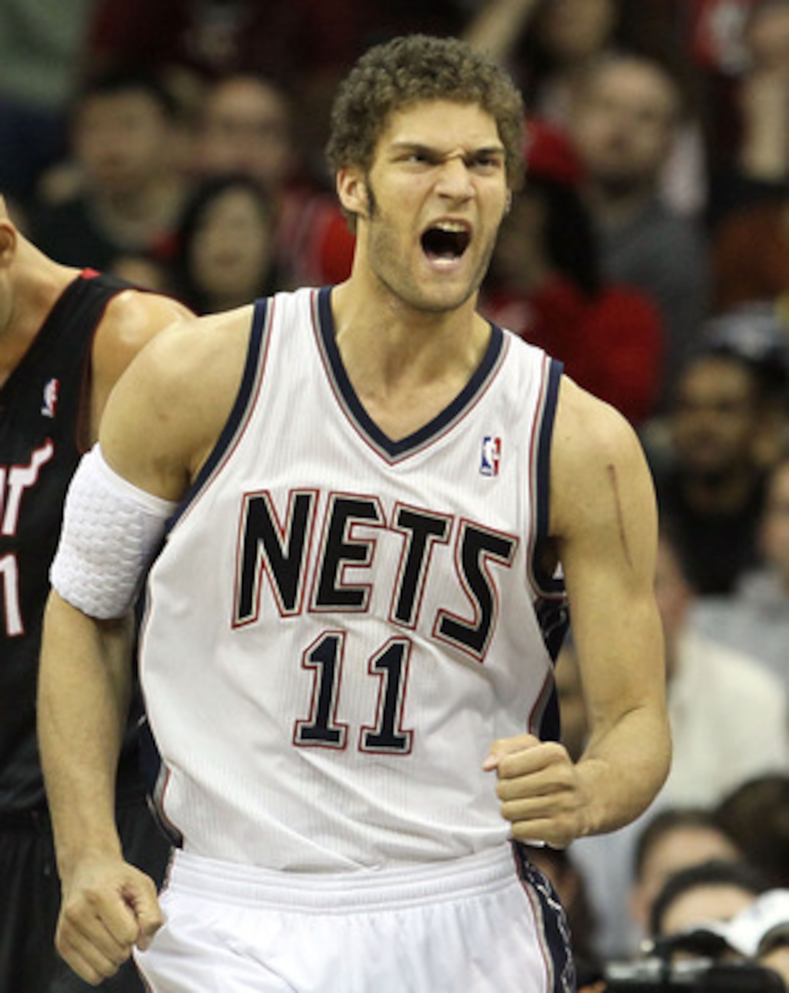 NEWARK, NJ - APRIL 03:  Brook Lopez #11 of the New Jersey Nets reacts against the Miami Heat at the Prudential Center on April 3, 2011 in Newark, New Jersey.The Heat defeated the Nets 108-94.NOTE TO USER: User expressly acknowledges and agrees that, by do