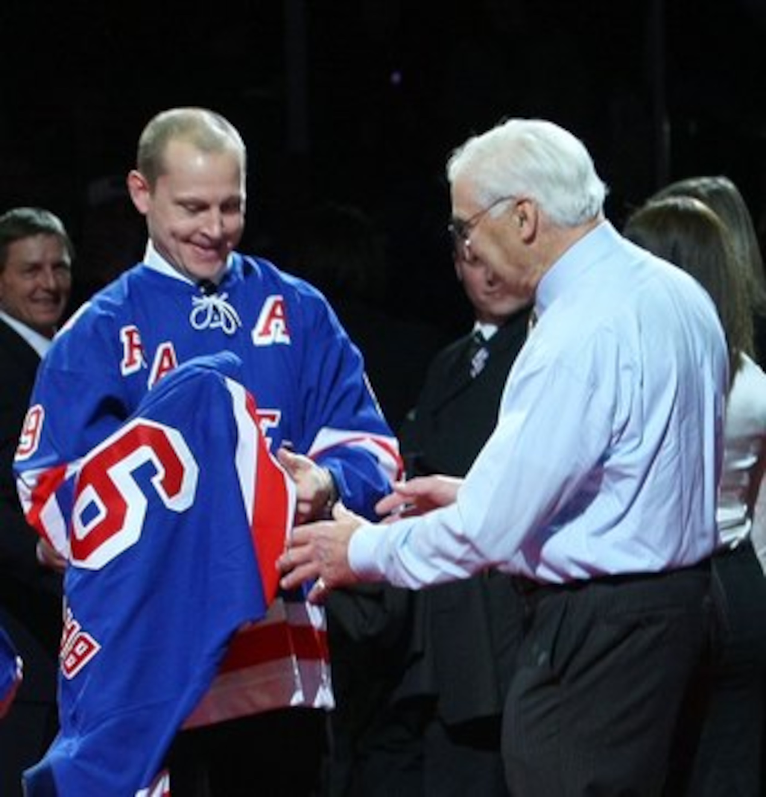 NEW YORK - FEBRUARY 22: Former New York Ranger players Mark Messier, Andy Bathgate and Adam Graves look over Bathgate's jersey during a ceremony prior to the game between the Toronto Maple Leafs and the New York Rangers on February 22, 2009 at Madison Squ