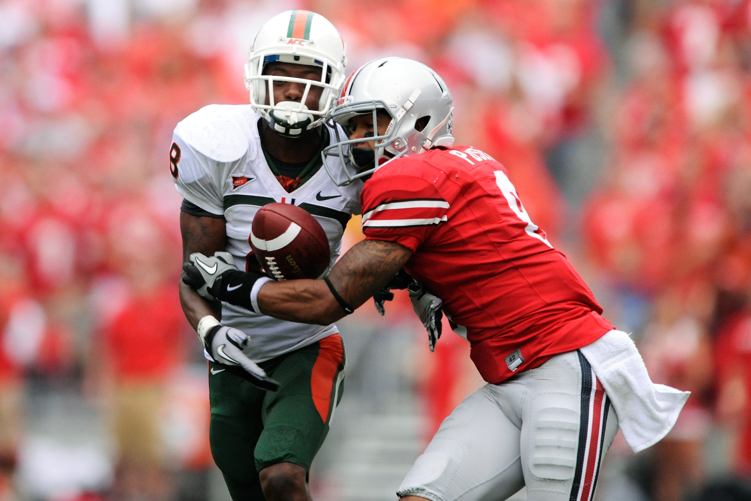 COLUMBUS, OH - SEPTEMBER 11:  DeVier Posey #8 of the Ohio State Buckeyes battles with DeMarcus Van Dyke #8 for possession of a pass at Ohio Stadium on September 11, 2010 in Columbus, Ohio.  The pass was incomplete.  (Photo by Jamie Sabau/Getty Images)